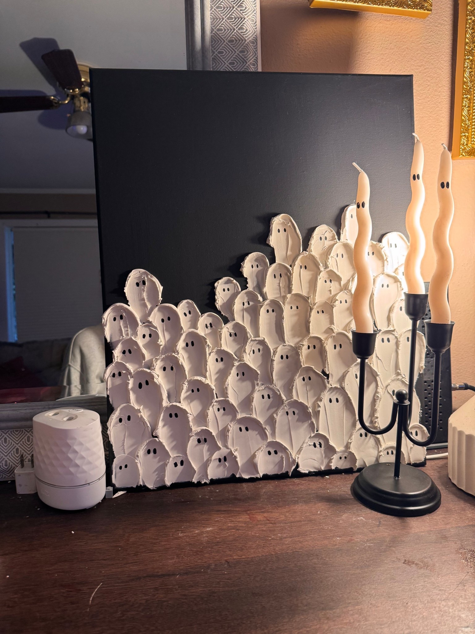 Make some DIY Halloween art!! 

The canvas came in a two pack from Walmart! I used plaster - “DryDex” it’s pink that dries white for the ghosts. I also used matte black acrylic paint also from Walmart! 

My candle holder is at Walmart for $13 & the wiggly candles are from Target - they were $3 on clearance! 

#LTKHalloween #LTKHoliday #LTKSeasonal