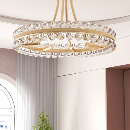Shop crystal chandeliers! The Jackeline 8 - Light Chandelier is ON SALE and is under $300.

Keywords: Crystal chandelier, gold crystal chandelier, dining room, living room

#LTKSaleAlert #LTKParties #LTKHome