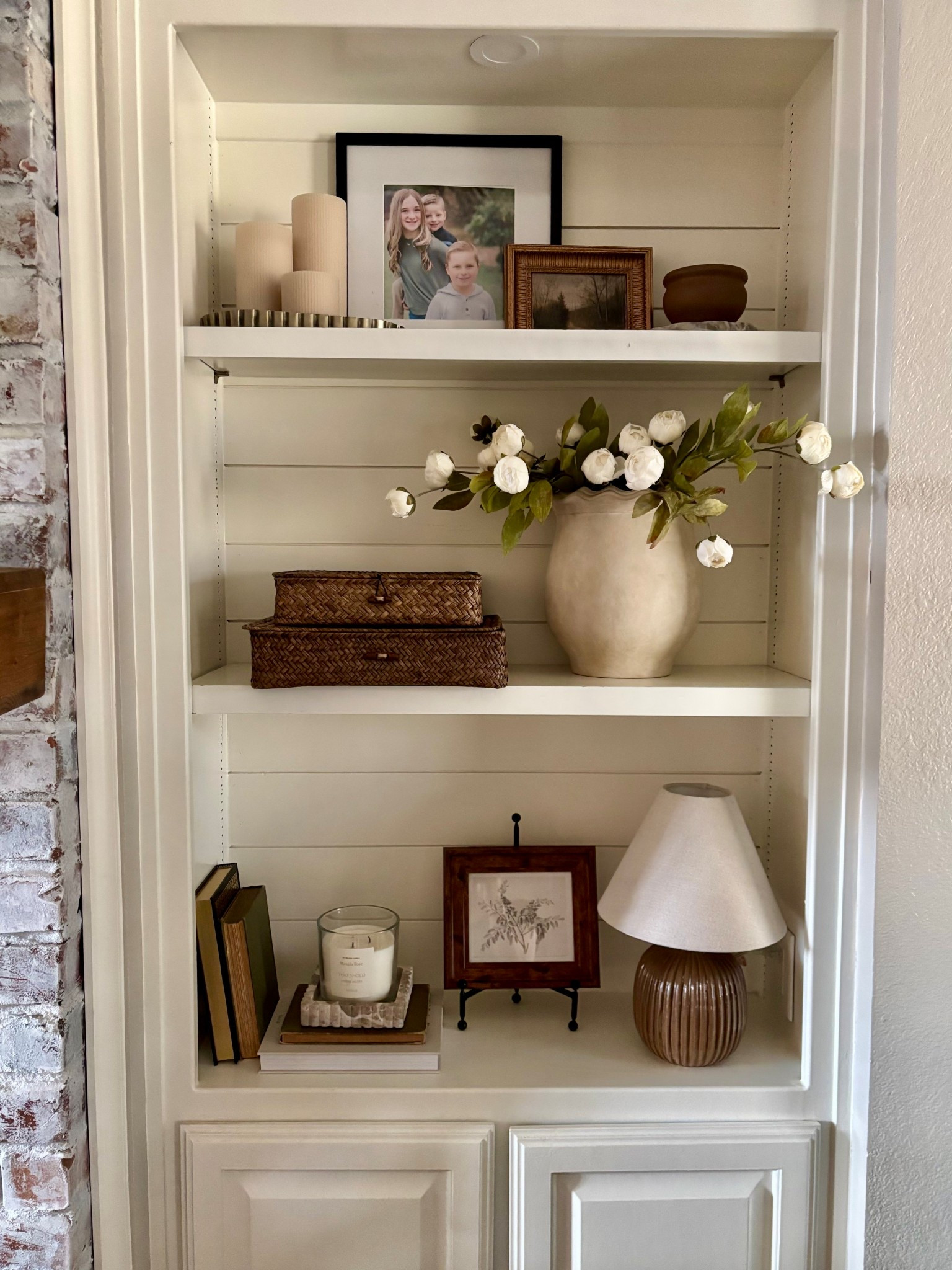 Bookshelf refresh! Love this cream peonies + vase combo!  Added this cute $12 Hearth and Hand art and these best selling rattan boxes! 