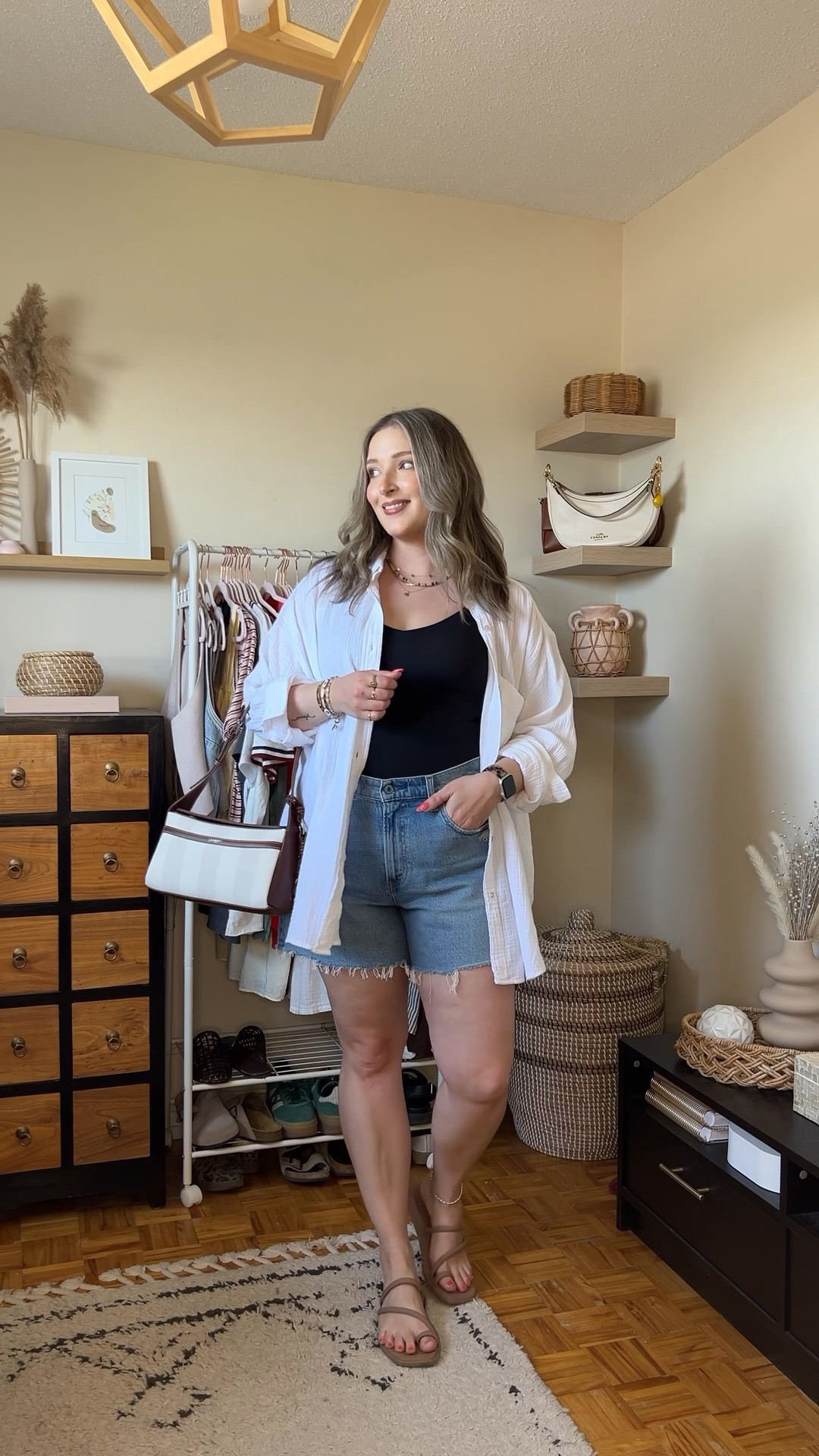 Go to summer outfit formula! Wearing M in the black tank (has a built in bra!) and L in the white button up shirt. Sized up to 32 in the denim shorts for a comfy fit. Crocs sandals are super comfortable, I’m a 9.5-10 and wear a 10. Canadian crocs link under “similar products”. Bag is Lambert

#LTKsummer #LTKstyletip #LTKmidsize