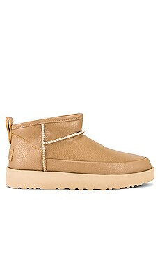 UGG Classic Sugar Ultra Mini Shearling Bootie in Sand from Revolve.com | Revolve Clothing (Global)