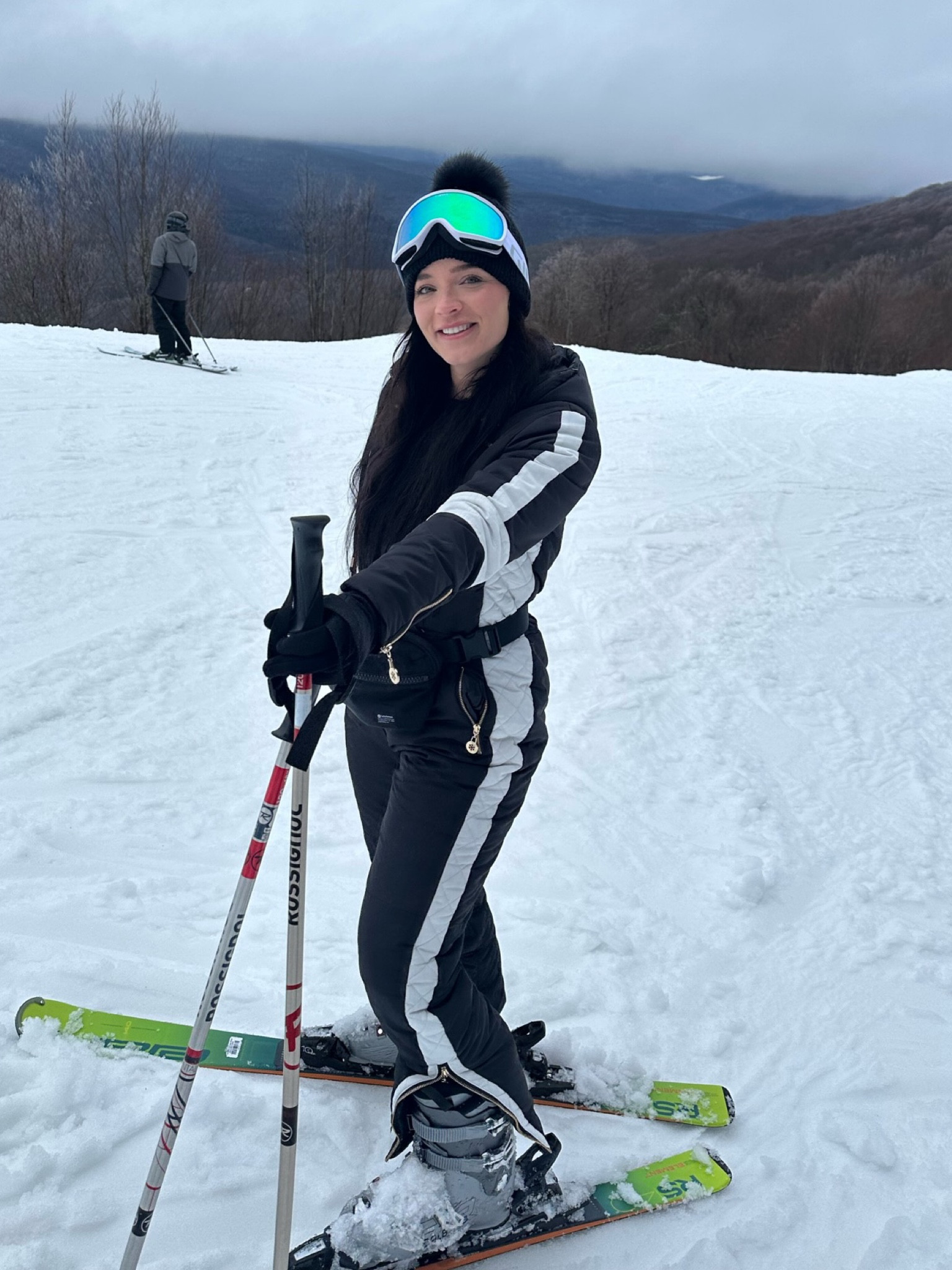 Black one piece snow suit with white stripe, zipper pockets, and belt- ski outfits- snow outfitt

#LTKtravel #LTKSeasonal #LTKfindsunder100