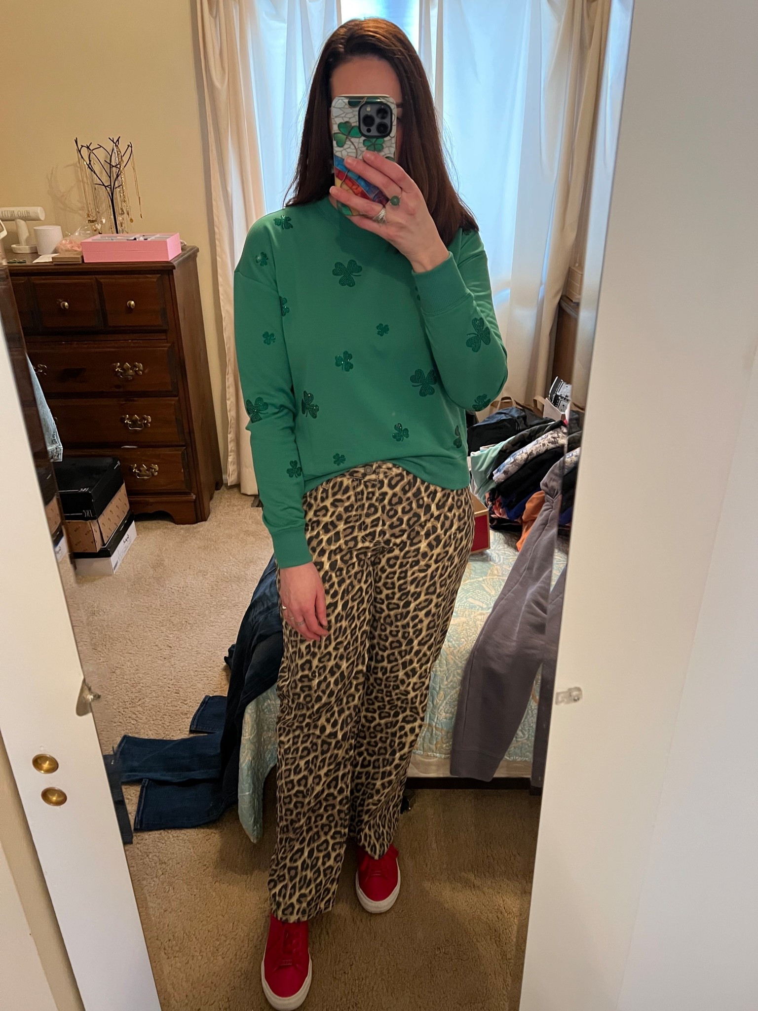 Green shamrock sweatshirt (xs). Leopard jeans (4). Red sneakers (8.5). #sweatshirt #shamrocksweatshirt #greensweatshirt #jeans #leopardjeans #sneakers #redsneakers #springoutfit #stpatricksdayoutfit 
spring outfits 2026
st patricks day outfit women

#LTKSeasonal #LTKootd
