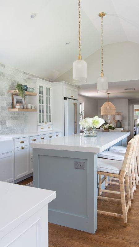 Coastal style kitchen with Serena and Lily wicker barstools, white cabinets, brass fixtures, and more home decor items

#LTKhome #LTKfamily
