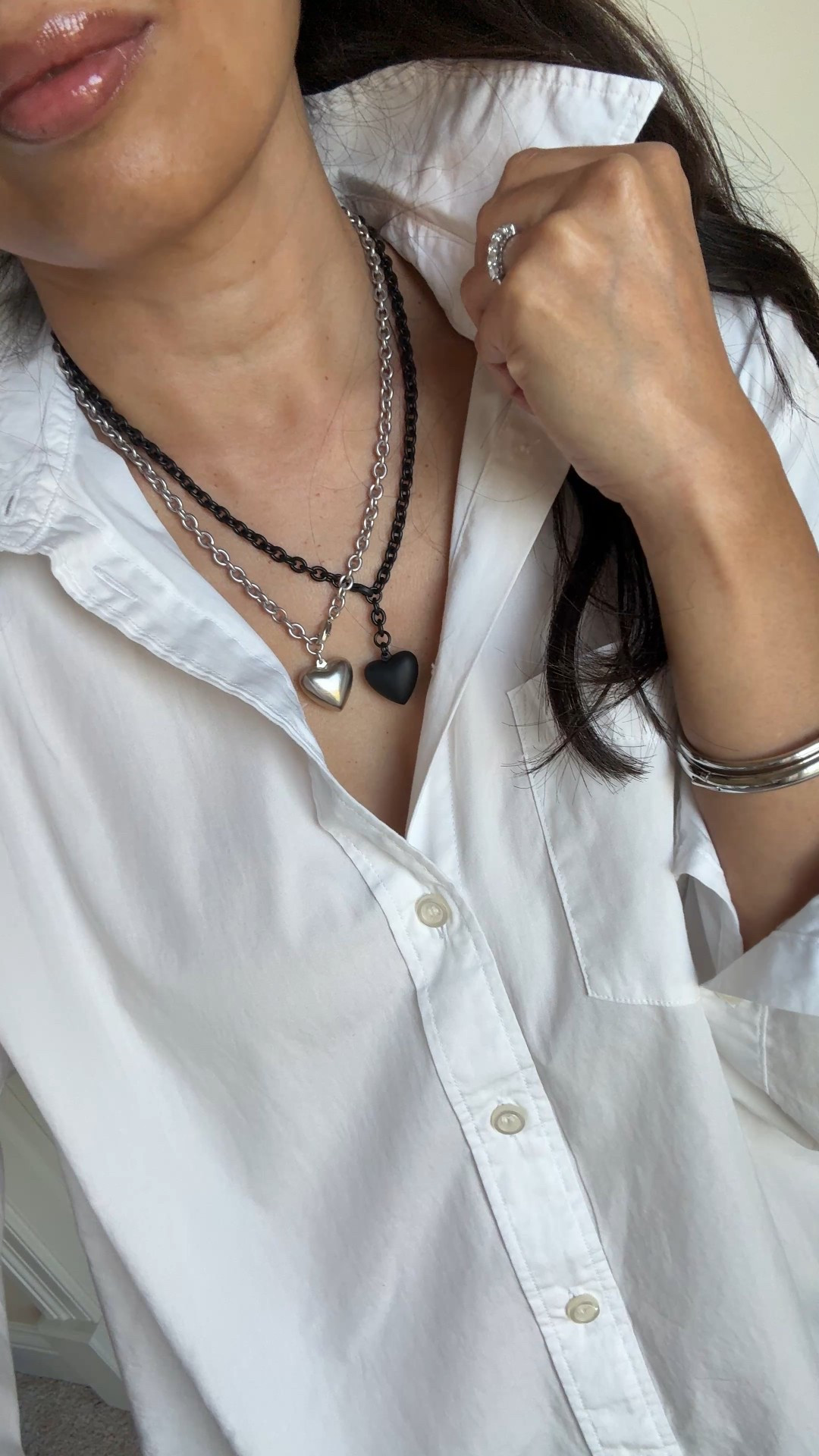 New necklace styled 4 ways  
I love the edgy chic look to this matte black heart necklace. Especially against a white top. 
Pairs well with:
-silver (necklace shown is the same style)
-gold (charm necklace shown is my most worn lately)
-pearls (for a more feminine vibe. Code Naomi20 to save)
-bling (to dress up for evening)
Exact button down is all cotton in an oversized style. True to size. Also linking the classic fit version. 
Favorite lip oil in shade pointelle. 


#LTKStyleTip #LTKFindsUnder100 #LTKOver40
