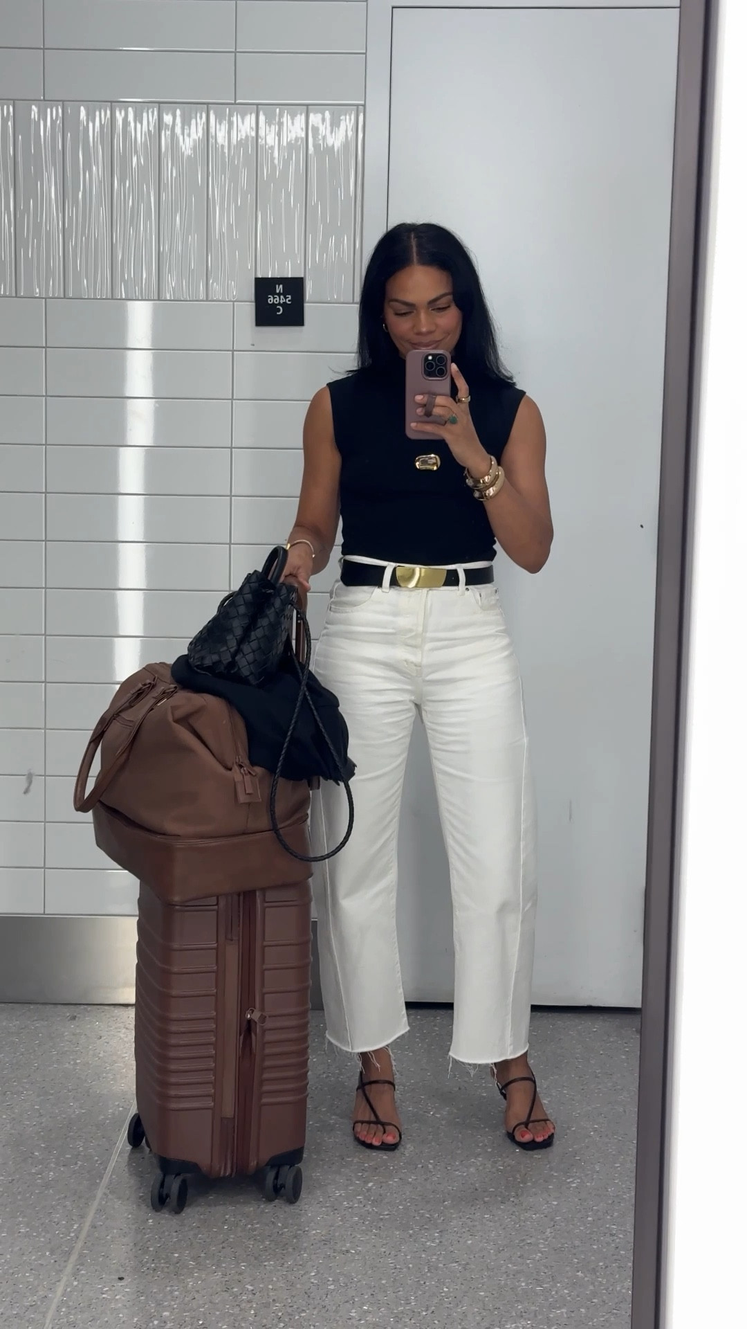 Airport outfit to Tokyo: white barrel jeans, mockneck top, gold hardware necklace, gold hardware black belt, black heels, beis carry on & weekender bag. Everything is tts. 

#LTKTravel #LTKStyleTip #LTKOver40