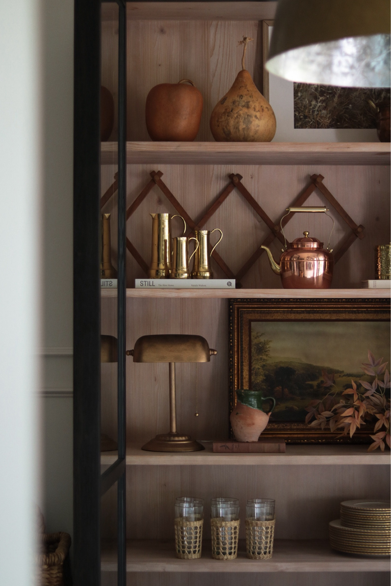 Fall Display Cabinet Shelf Styling 🍁

Faux Pumpkins, Faux Gourds, Accordion Rack, Brass Desk lamp, Lamp DIY, Vintage Art, Gold Plates, Floating Shelf

#LTKHome #LTKSeasonal #LTKFindsUnder50