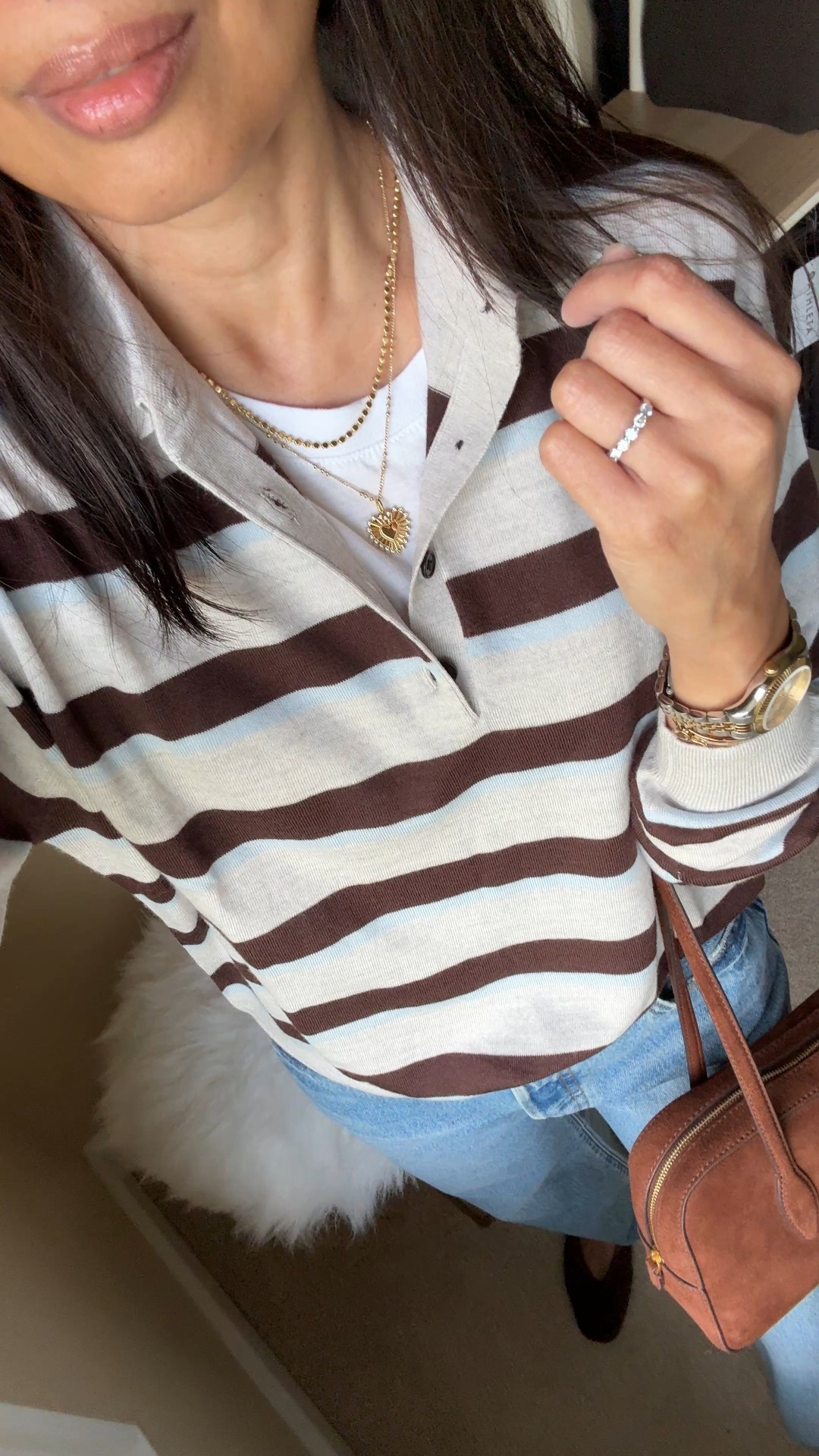 Classic Fall outfit: striped polo & jeans. 
- This exact polo is a sweater done in merino wool. Feels luxe and can be worn alone or layered. I sized up for a relaxed fit. It has been a popular one and has been restocking periodically  
- Straight leg 90s jeans always work. I size up in my favorite true 100% cotton denim style. 
- Suede handbag. Trying out a non crossbody style to change things up and this one is easy to carry on the shoulder or arm. 
- Suede flats in chocolate brown. Linking a variety of options for the look. 
- Classic everyday gold necklaces and cuff bracelet  


#LTKSaleAlert #LTKStyleTip #LTKOver40