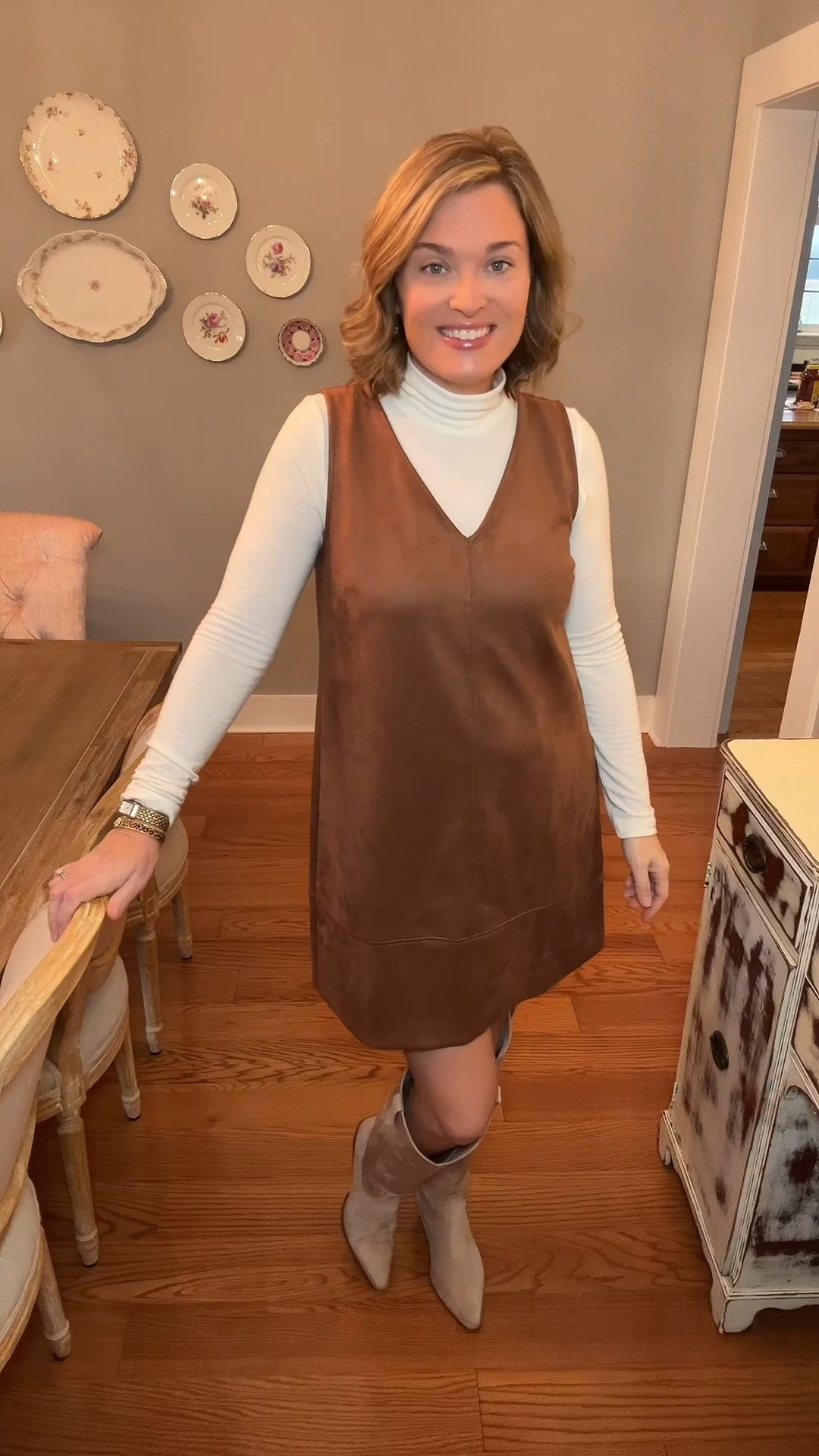 Friday layers 🤎 Proof that over-40 work fashion can be polished, comfortable, and still cute. Brown suede jumper dress, cream turtleneck, and knee-high boots—simple wins.

💼 Comment YES for details 

#LTKWorkwear #LTKOver40 #LTKmomlife