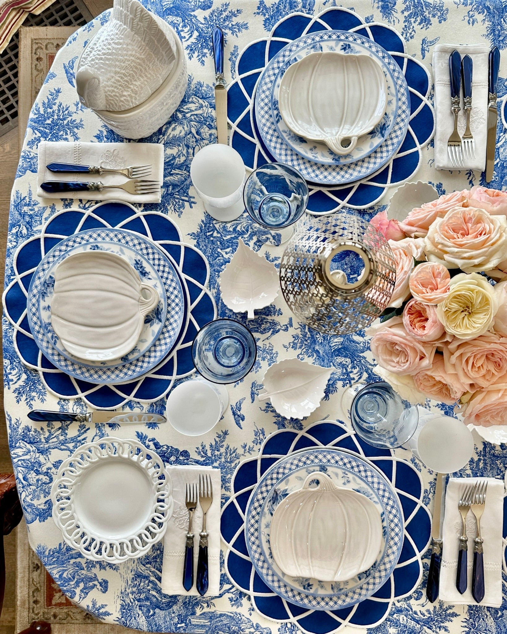 Fall table blue and white pumpkin plates blue toile embroidered placemats 

#LTKParties #LTKSeasonal #LTKHome