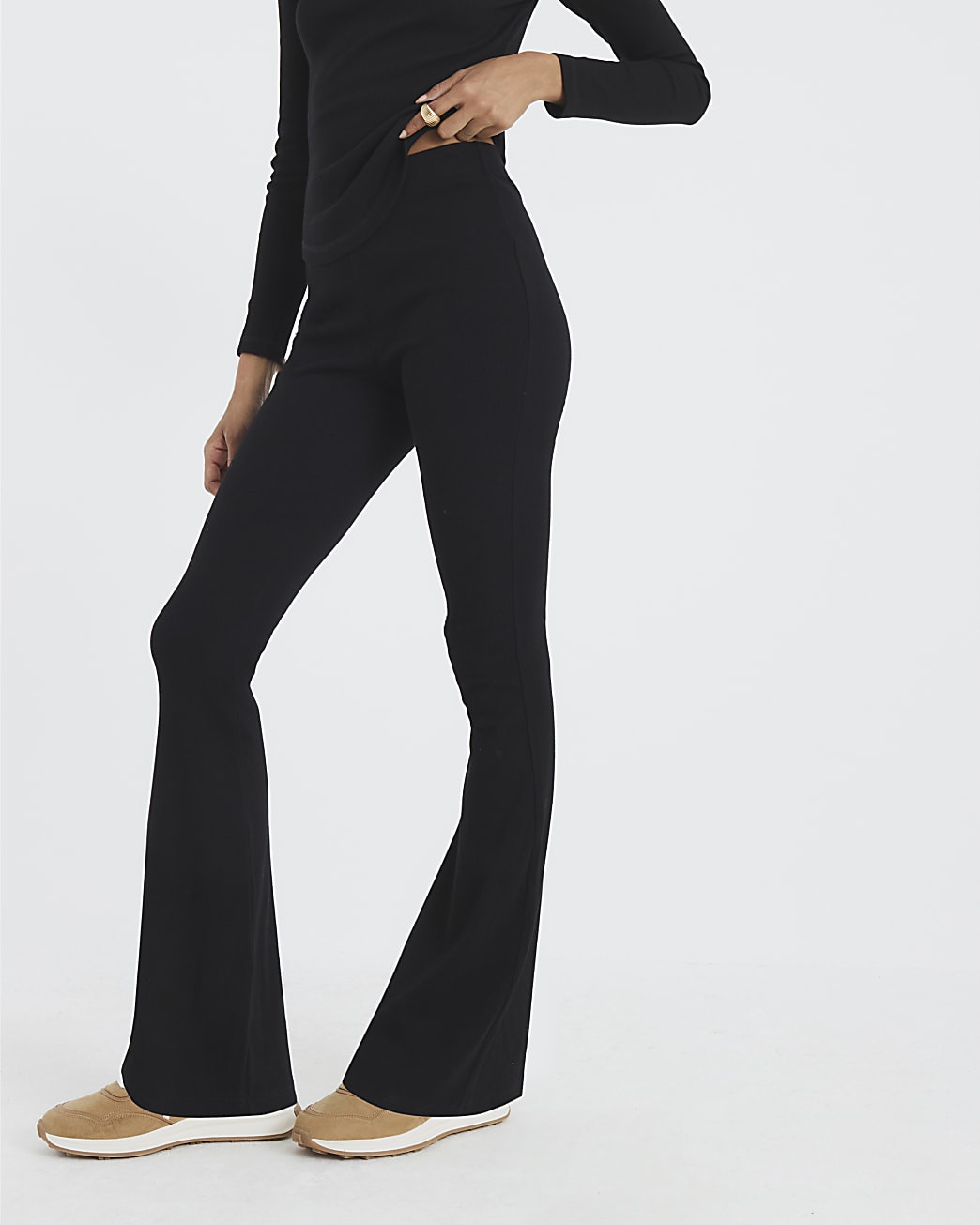 Black High Waisted Ribbed Flare Leggings | River Island UK & IE