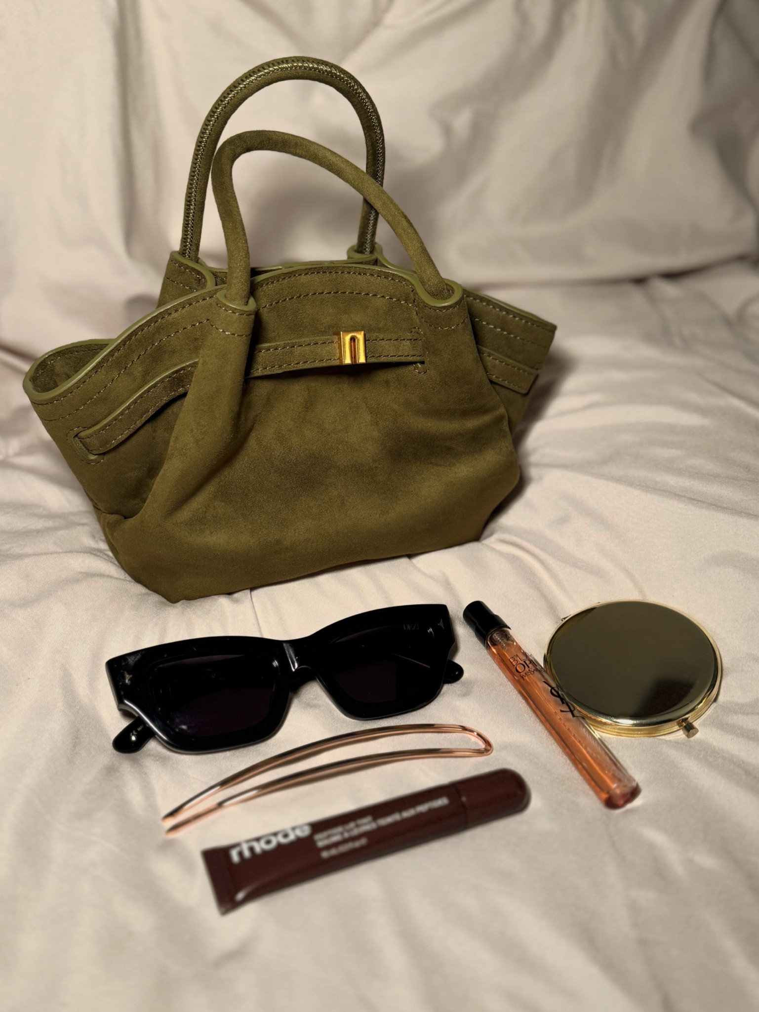 What’s in my bag?! JW PEI purse, Hana mini bag, Dezi sunglasses, French pin, gold French
Pin, rhode lip tint, espresso lip tint, YSL black opium, black opium, YSL,  pocket mirror

#LTKSeasonal #LTKItBag