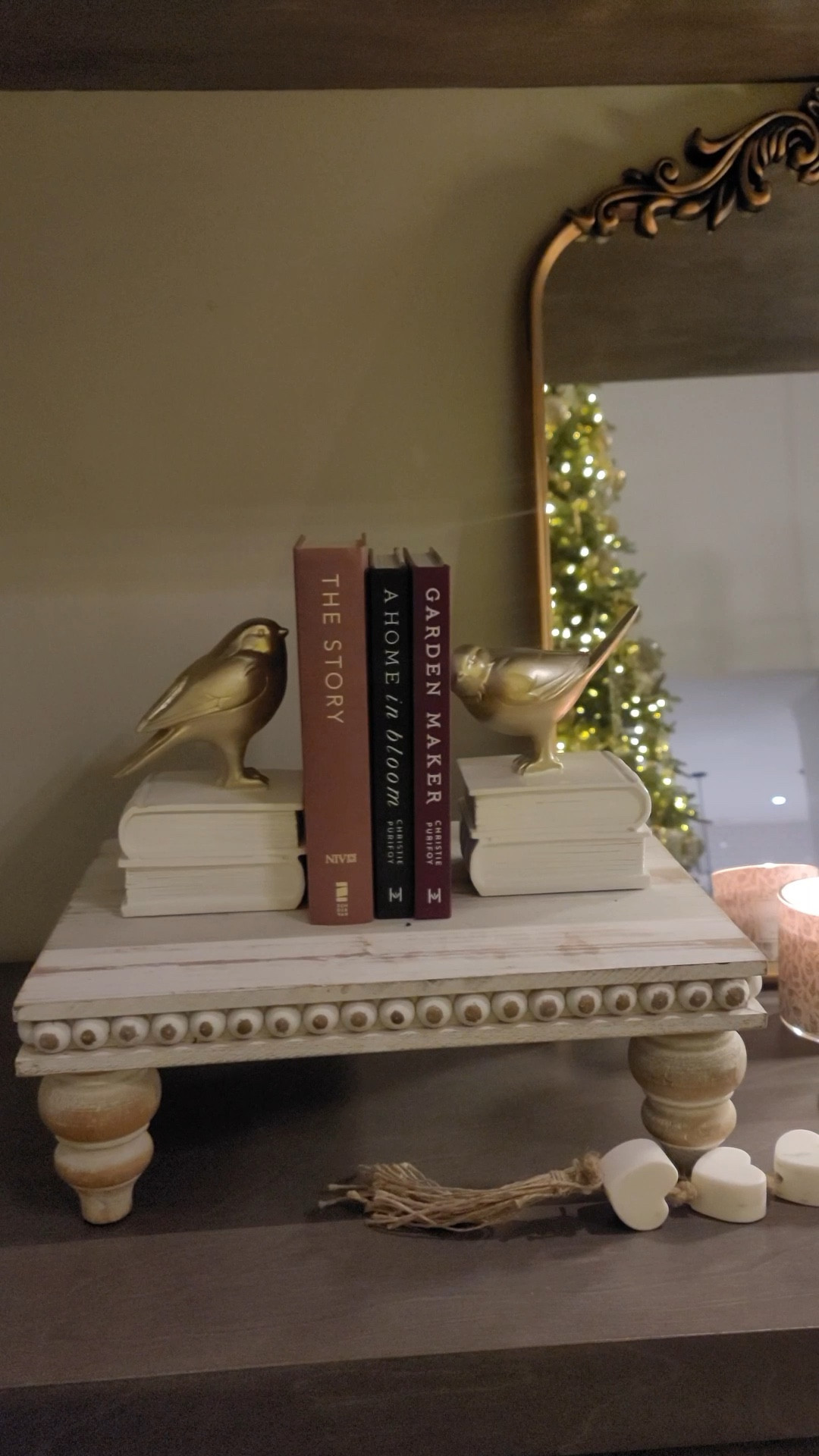 A cozy styled shelf is lovely this time of year. Sweet bird book ends flank some of my favourite books. This marble heart garland was a gift from my daughter and I love it. The cordless rechargeable lamp warms and brightens the area. My all time favourite gold mirror is the perfect backdrop. The candle wick kit is so handy and I use it all the time. Gone are the days of blowing wax everywhere when I put out the candles!

#LTKdayinmylife #LTKHome #LTKFindsUnder50