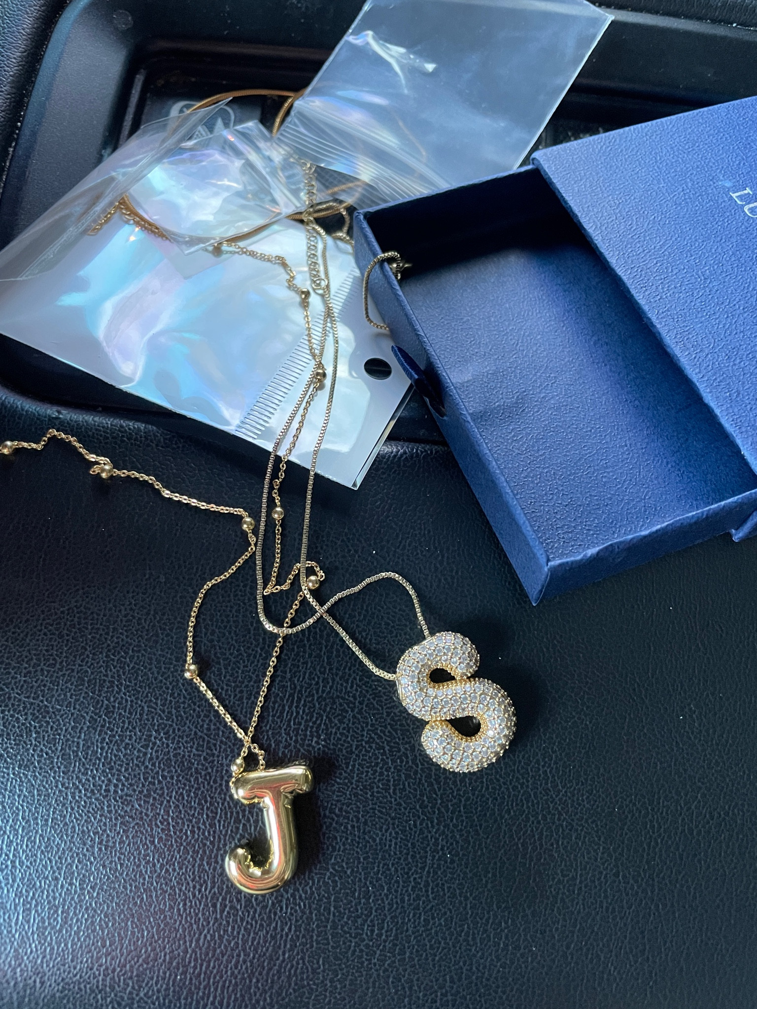 Don’t mind my messy car I’ve got five kids! 😂


You’re here for the cute necklaces. They’re both from Amazon.😍