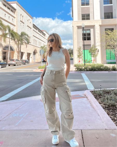 Beige utility jeans and tank outfit. My tank is under $10 and I have in almost every color. I wear these alone or layered and it’s not cropped, see thru or too thin. Jeans are new and I love this beige color! Wearing this outfit with white sneakers 👟 

#LTKsalealert #LTKstyletip #LTKSeasonal