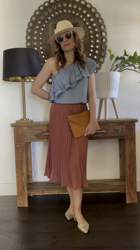 Remixing the oldies- I have had this top for many years- I think it’s Loft.  The leather envelope clutch is Able.  I paired it with my new skirt of the season.  

#LTKfindsunder50 #LTKSeasonal #LTKover40