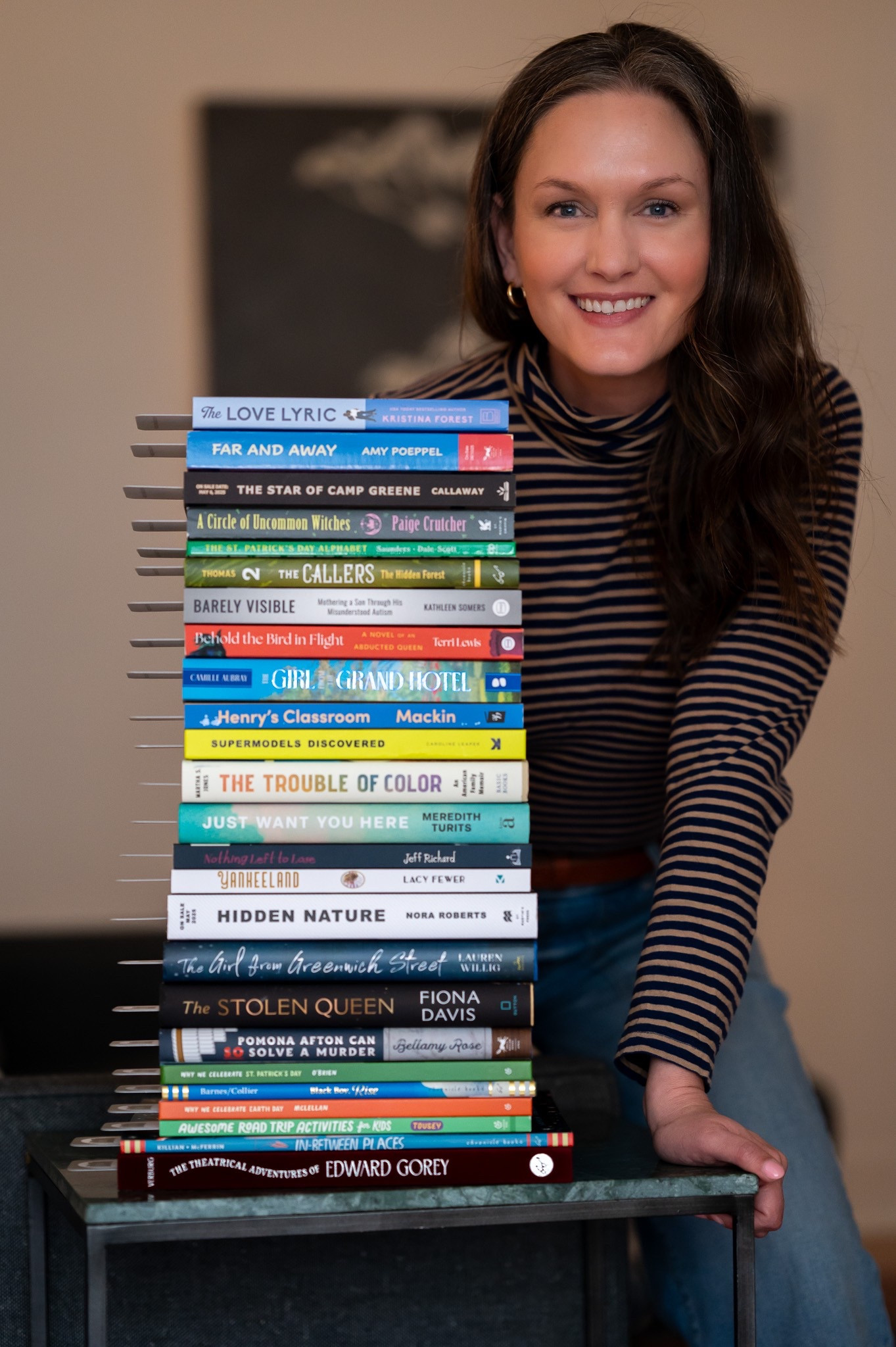 Dressed in a lightweight navy and taupe striped tissue turtleneck, its soft fabric skimming her skin like the first warm breeze of spring, she feels effortlessly herself. Wide leg jeans pool at her ankles, a casual yet confident choice, while gold hoop earrings catch the light with every turn of her head. A fresh stack of book mail waits on the table, each package holding the promise of stories ready to unfold. As she carefully opens each one, the scent of crisp pages fills the room, sparking the familiar thrill of possibility. In the third week of March, with the world on the edge of blooming, she feels like the main character in her own life—curious, hopeful, and savoring the small moments that make each season special.

#LTKStyleTip #LTKFamily #LTKWorkwear