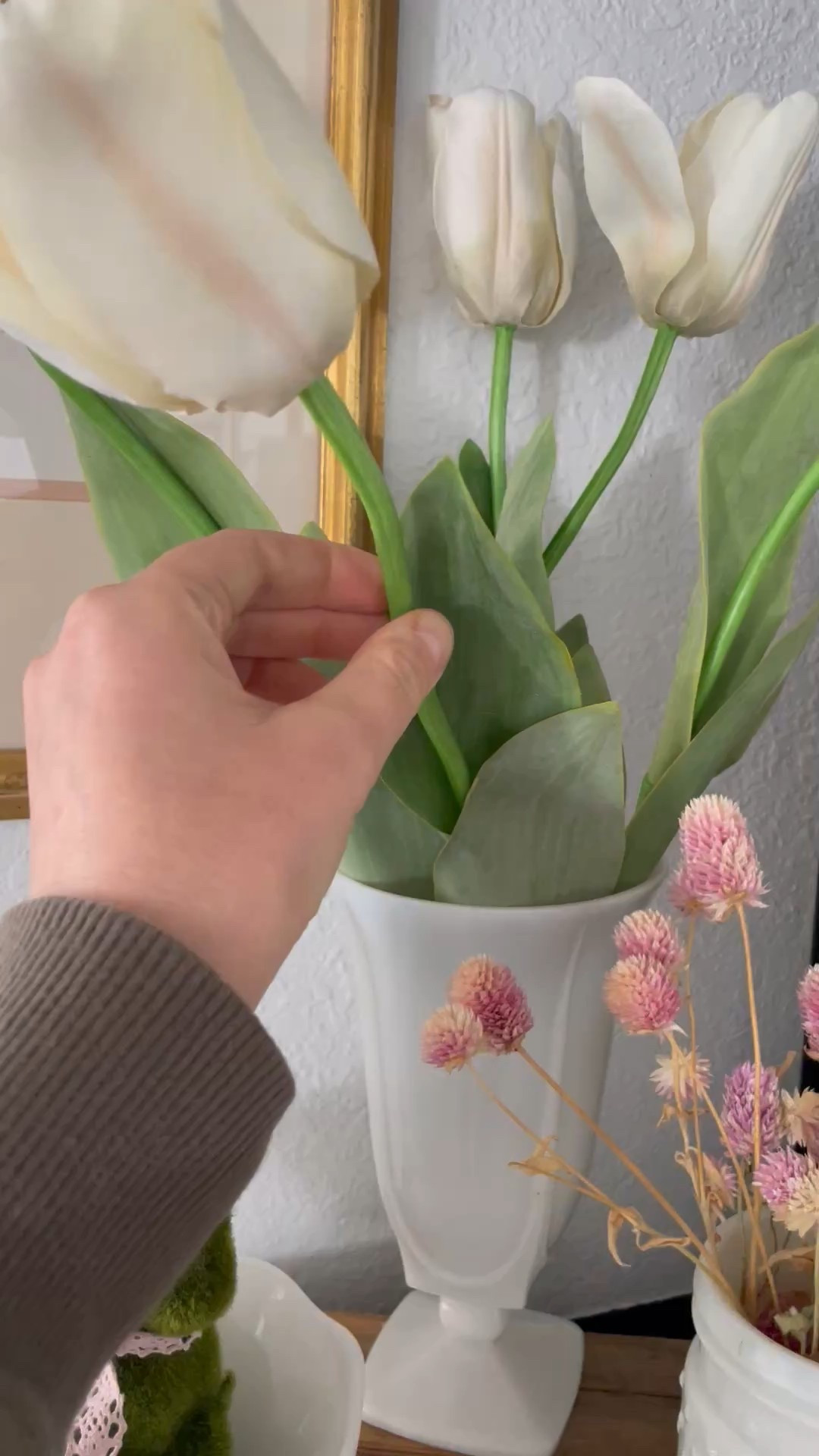 Fresh and cheery Spring mantle decor!
Update and refresh a mantel space for Spring on a budget  through the use of vintage milk glass, floral stems, and other thrifted accessories.
You truly don’t need to do much when it comes to styling a space with vintage!

#LTKFindsUnder50 #LTKHome #LTKSeasonal