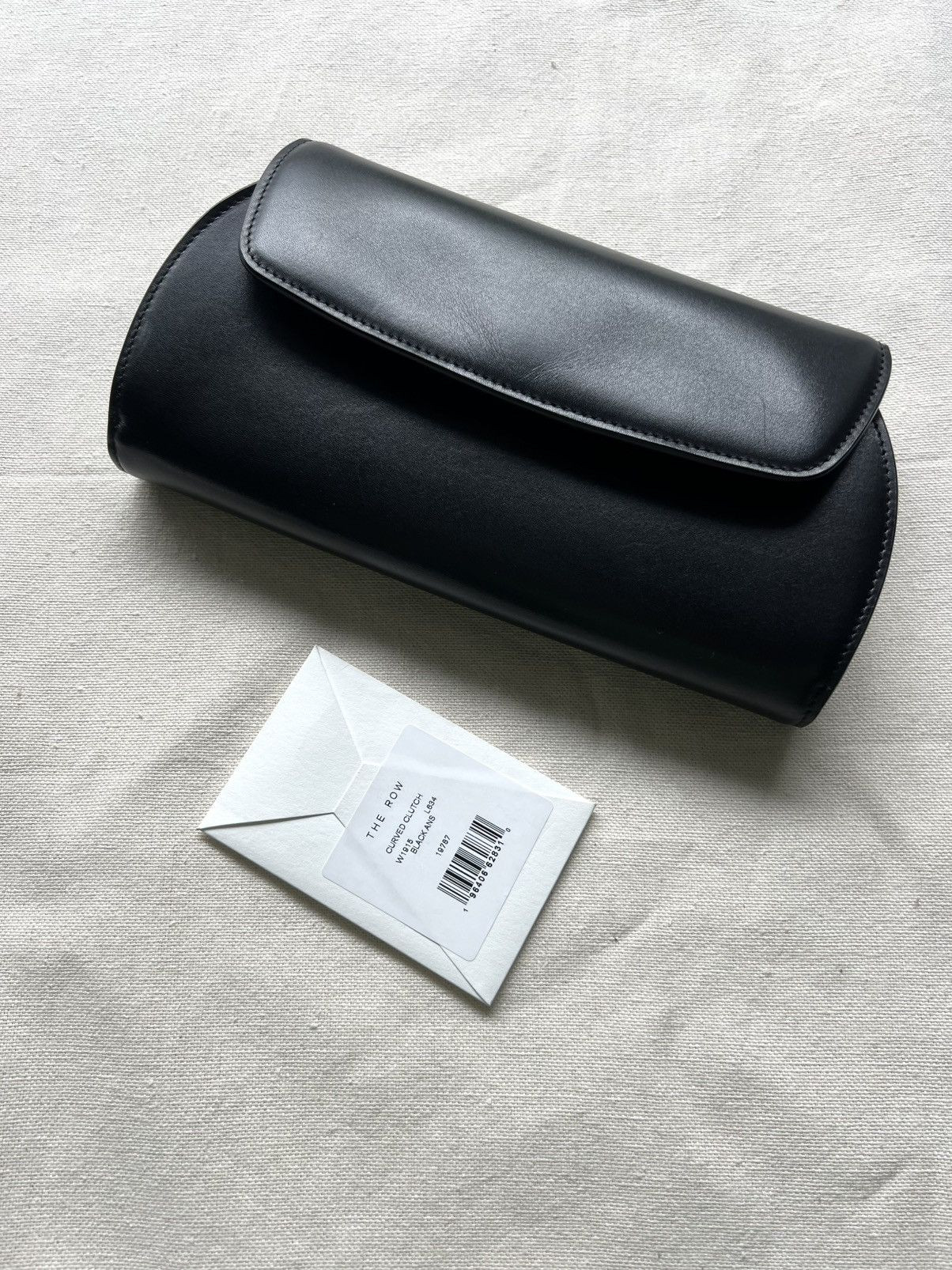 The Row ‼️$2.9K VALUE‼️The Row Leather Curved Clutch Bag | Grailed | Grailed
