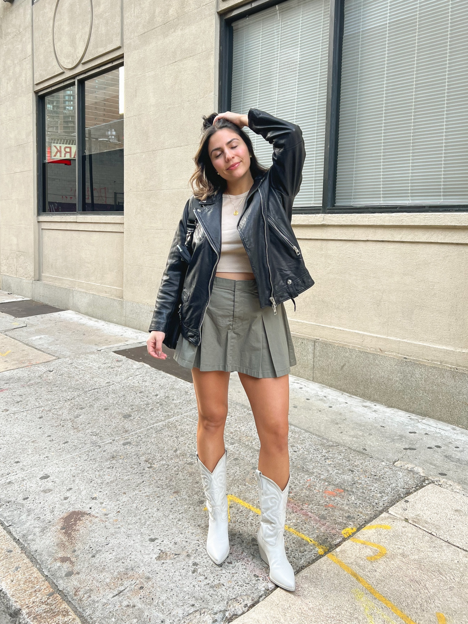 Cowboy boot outfit idea: Abercrombie skort (SO comfortable - true to size), ribbed tank top from aerie, leather jacket from Madewell, and Steve Madden cowboy boots (true to size, comfy!!)

#LTKshoecrush #LTKFestival #LTKFind