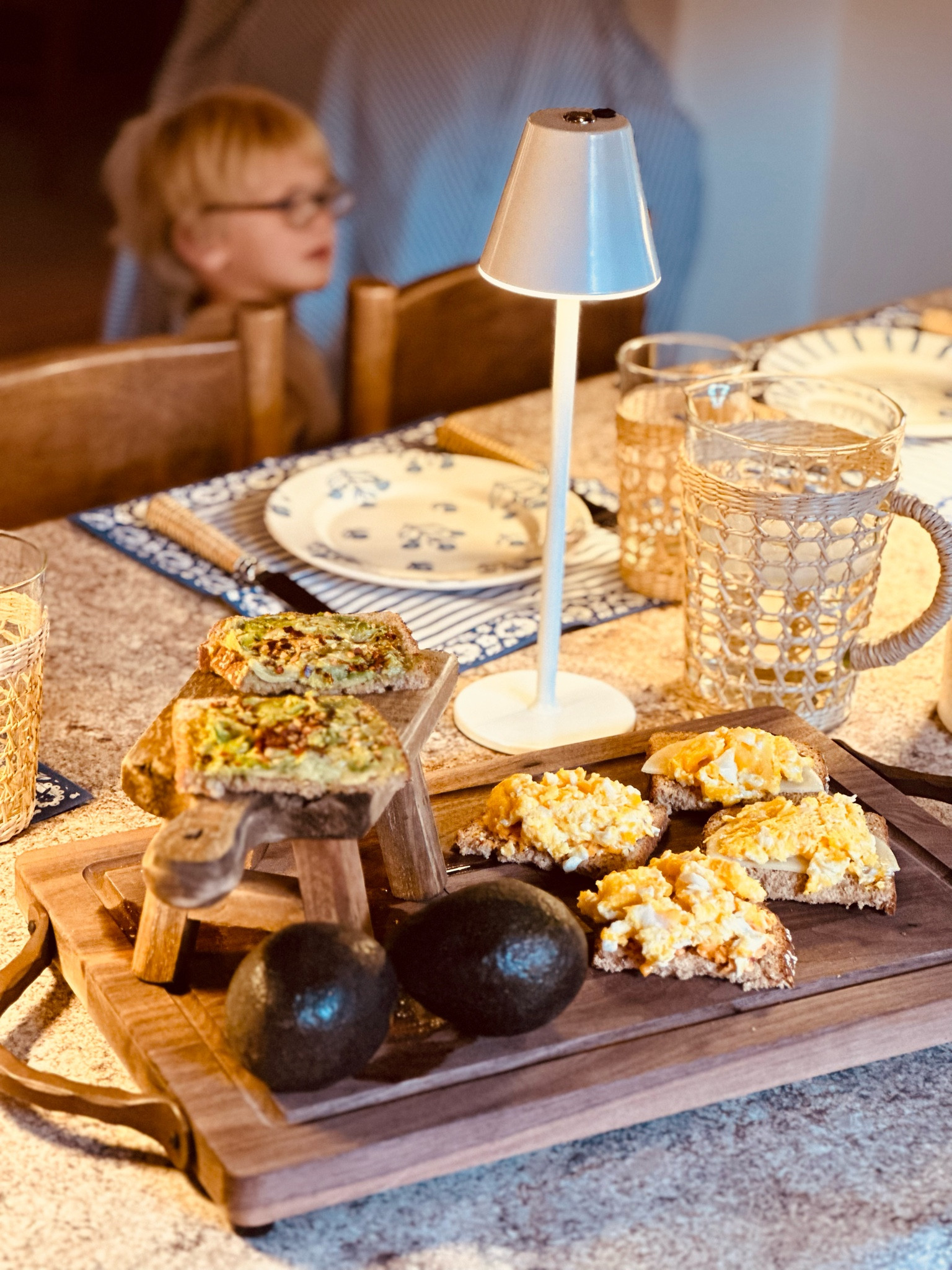 I wanted to give you another look at our breakfast table this morning. I made various types of toasts to suit different tastes.
You can see the rechargeable lamps that I like to use - there is one at each place setting.
I’ve been reading cookbooks and looking at food styling and as with all tabletops you want to add some height so you can see I stacked a wooden stool on the cutting board to display the food. 


#LTKunder50 #LTKhome #LTKFind