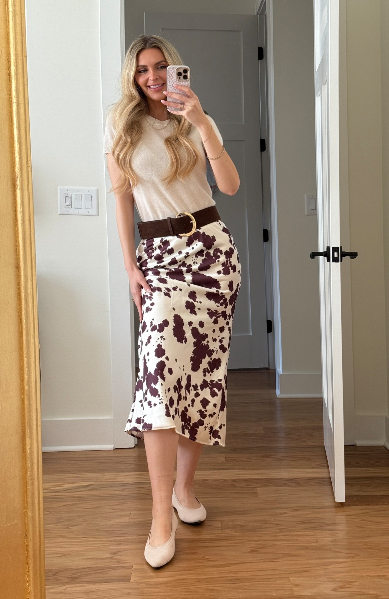 Cow print skirt: how to style 

I paired this satin cow print skirt with an ivory cashmere top, a brown suede belt, and some simple flats

Perfect fall outfit, especially for me living in Nashville 💅

The skirt is actually from Altered State, in small, but I can’t link them here. (Linked almost identical) 

Shirt is Quince in XS
Belt is Commense 
Shoes are Vivaia 



#LTKSeasonal #LTKOver40 #LTKFindsUnder50