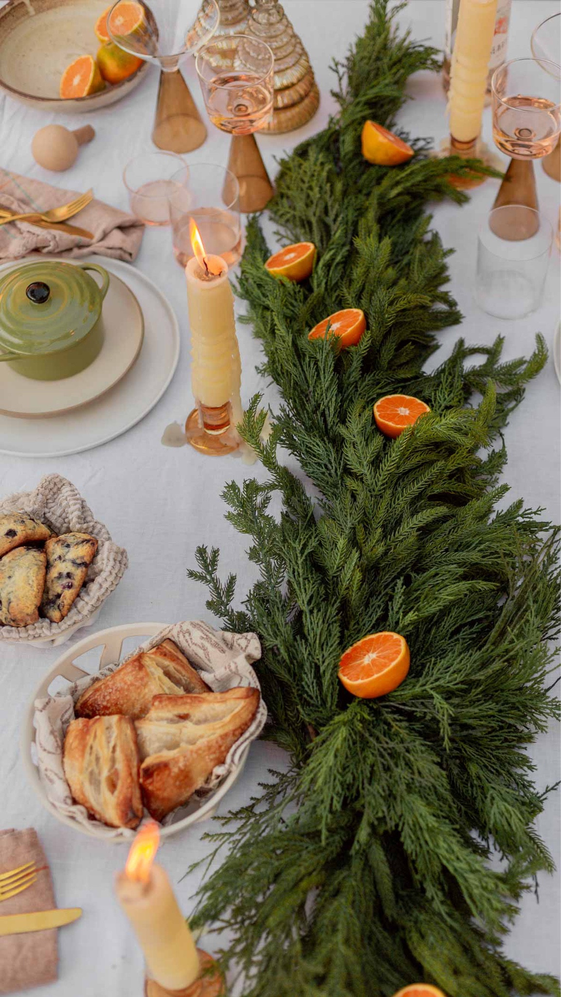 Holiday tablescape inspo with a Christmas garland table runner, geometric candlesticks, individual mac cheese mini crocks, stoneware bread baskets, etc. holiday entertaining - Christmas tabletop decor - holiday party

#LTKhome #LTKSeasonal #LTKHoliday