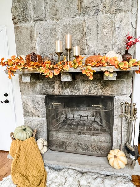 Fall Mantle Decorated with a beautiful leaf garland which is lighted 

Fireplace decor 
Fall candles
Candle holders
Pumpkins
Burnt Orange decor


#LTKhome #LTKSeasonal