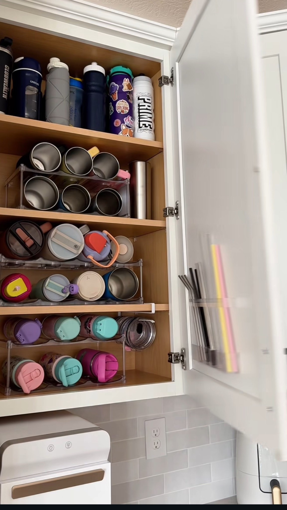 The BEST way to organize water bottles, straws, and lids! The organizers fit so many different sizes of tumblers and water bottles! 

#LTKFindsUnder50 #LTKHome #LTKmomlife