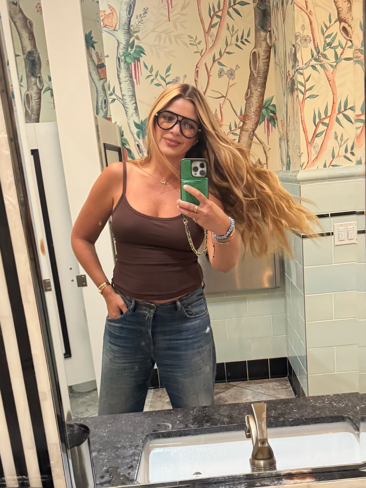 This tank has a built in bra and is made of natural filters (size medium)…I have 3 
Jeans are my favorite as of late (size 27) 
Hair is Académie Hair Sea Glass
Also linked my glasses and bag! 

#LTKBeauty #LTKdayinmylife