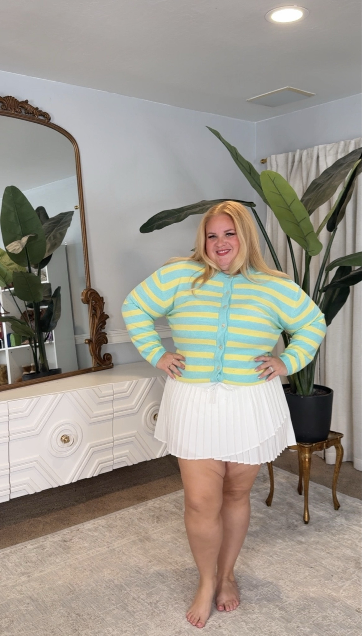 Preppy but make it curve friendly 💚

This striped cardigan is lightweight, soft, and actually buttons without pulling. The cropped length hits at the right spot so it defines your waist instead of cutting you off.

Paired it with this pleated mini for that tennis skirt vibe without feeling exposed. It floats away from the tummy and gives that easy, flirty movement when you walk.

Such a good spring transition look. Linked in my LTK with sizing details.

#LTKPlusSize #LTKActive #LTKOver40
