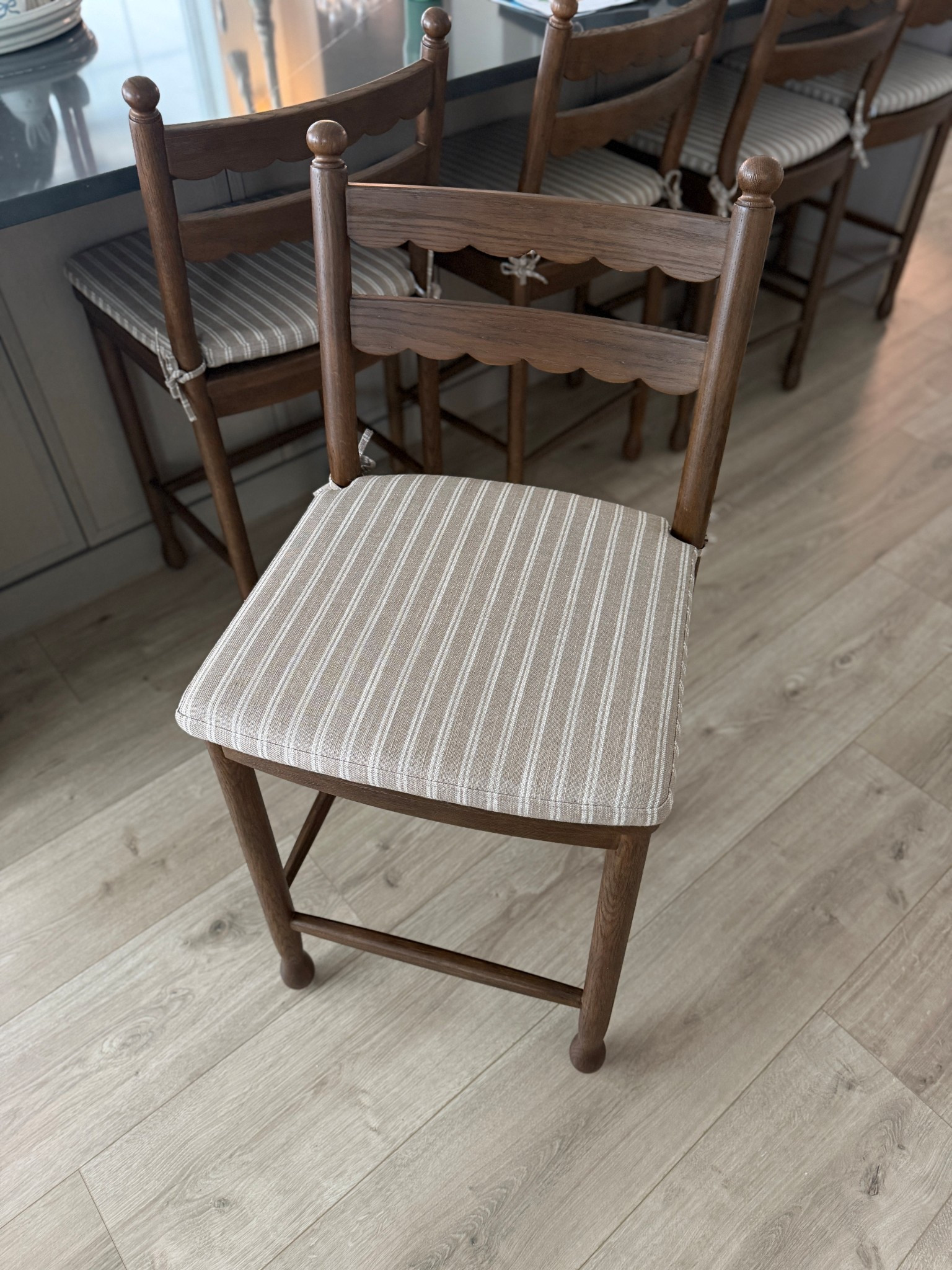 Our pretty dark oak counter stools are on sale! These are definitely a splurge, but they are solid wood. The cushion cover unzipped for cleaning and is reversible.  The details on these are stunning!!

#LTKSaleAlert #LTKHome