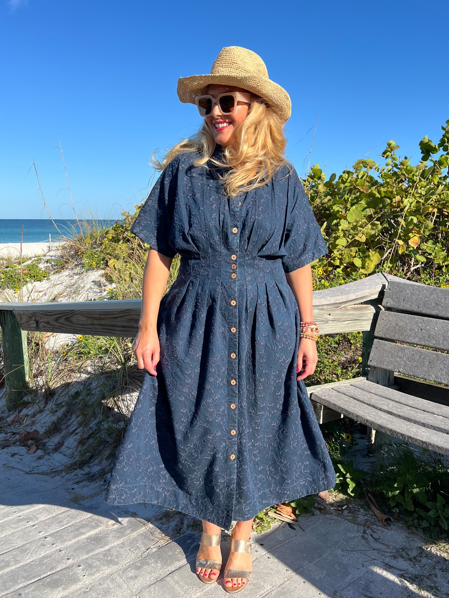 🏝️SOFT SURROUNDINGS: #ad Packing for a calm getaway? Here’s the dress you need! @soft_surroundings #softsurroundings 

👗My embroidered short sleeve midi dress flatterers with front and back tucks that define your waist. Love the tonal embroidery and beautiful floral pattern. You can wear this meeting friends for a lunch date, a beach getaway or everyday wear. Effortless style + versatility + breathable fabric = The dress you need!

🫶🏻Truly looks like a sophisticated denim dress. Buttons down the front, has side pockets and so soft! I’m wearing a medium and it fits true to size. Available in XS-3X. Color: Embroidered medium wash.

👒When heading out to the beach, don’t forget to pick up my Catalina Cowboy hat! This raffia hat features a colorful braided faux suede hatband and has an interior adjustable sweatband that makes it comfy. Also love the shapeable three inch brim to offer extra sun protection. 

🙌🏼In addition to my hat, I’m wearing a set of five bracelets with matching earrings. The genuine rhodonite beads in pinks, golds and earth tones look fantastic for spring and summer.

👡You can’t forget about these insanely comfortable textured sandals. Obsessed! This golden leather sandal has a soft shimmer and glow. Elevated and chic. You’ll be reaching for these all spring and summer long. I walked around all day and my feet felt great. Order your normal size. These are fantastic!

👉🏼Follow my shop @jtstjtst11 on the @shop.LTK app to shop this post and get my exclusive app-only content!

#liketkit 
@shop.ltk

#LTKSeasonal #LTKOver40 #LTKMothersDay #LTKU #LTKTravel #LTKgrwm #LTKootd #LTKMidsize #LTKSwim #LTKFestival