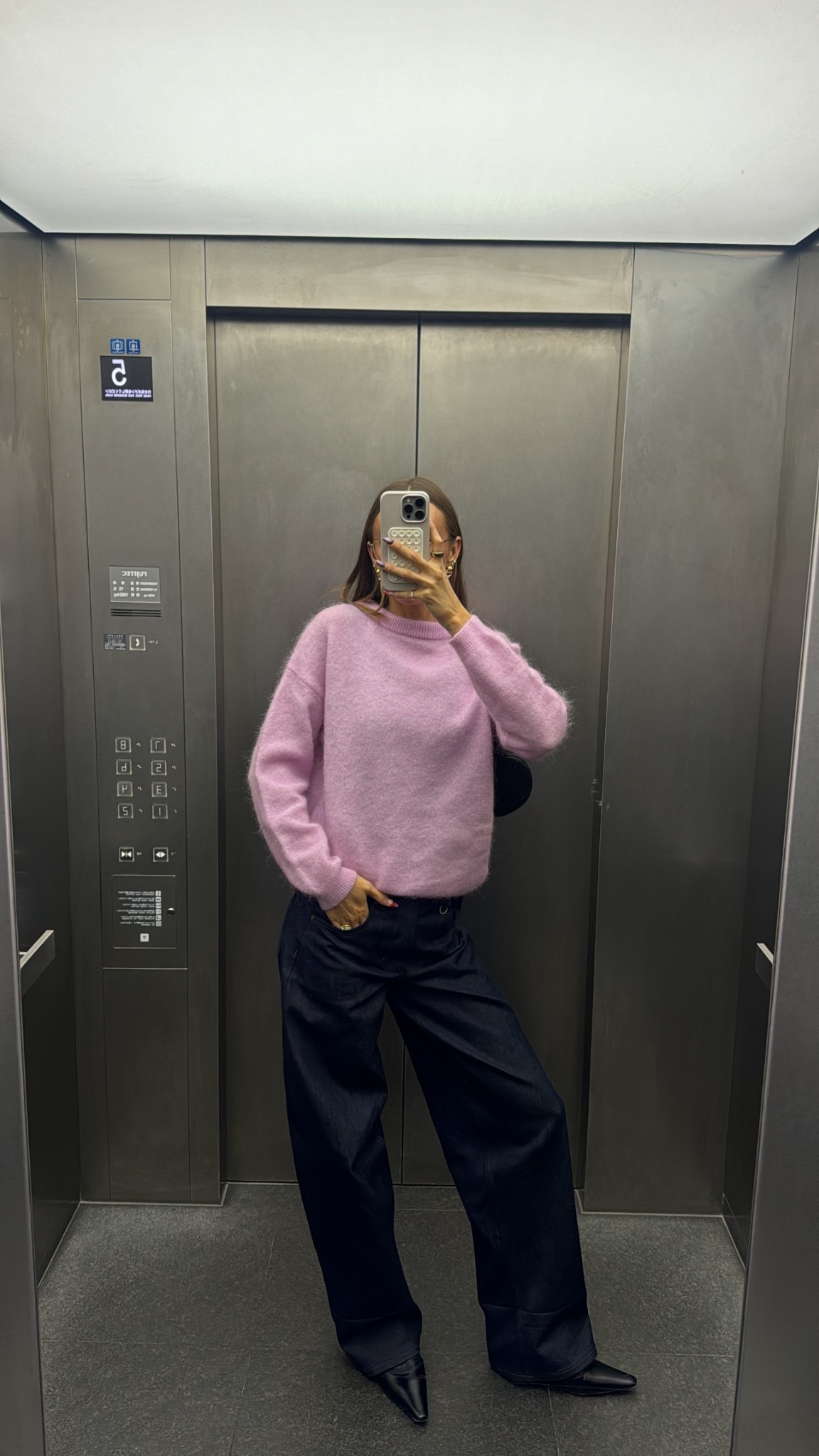 Elevator OOTD’s in Japan 🇯🇵  my current favourite jeans & vintage find sweater Linked exact + similar pieces! 

#LTKtravel #LTKstyletip #LTKaustralia