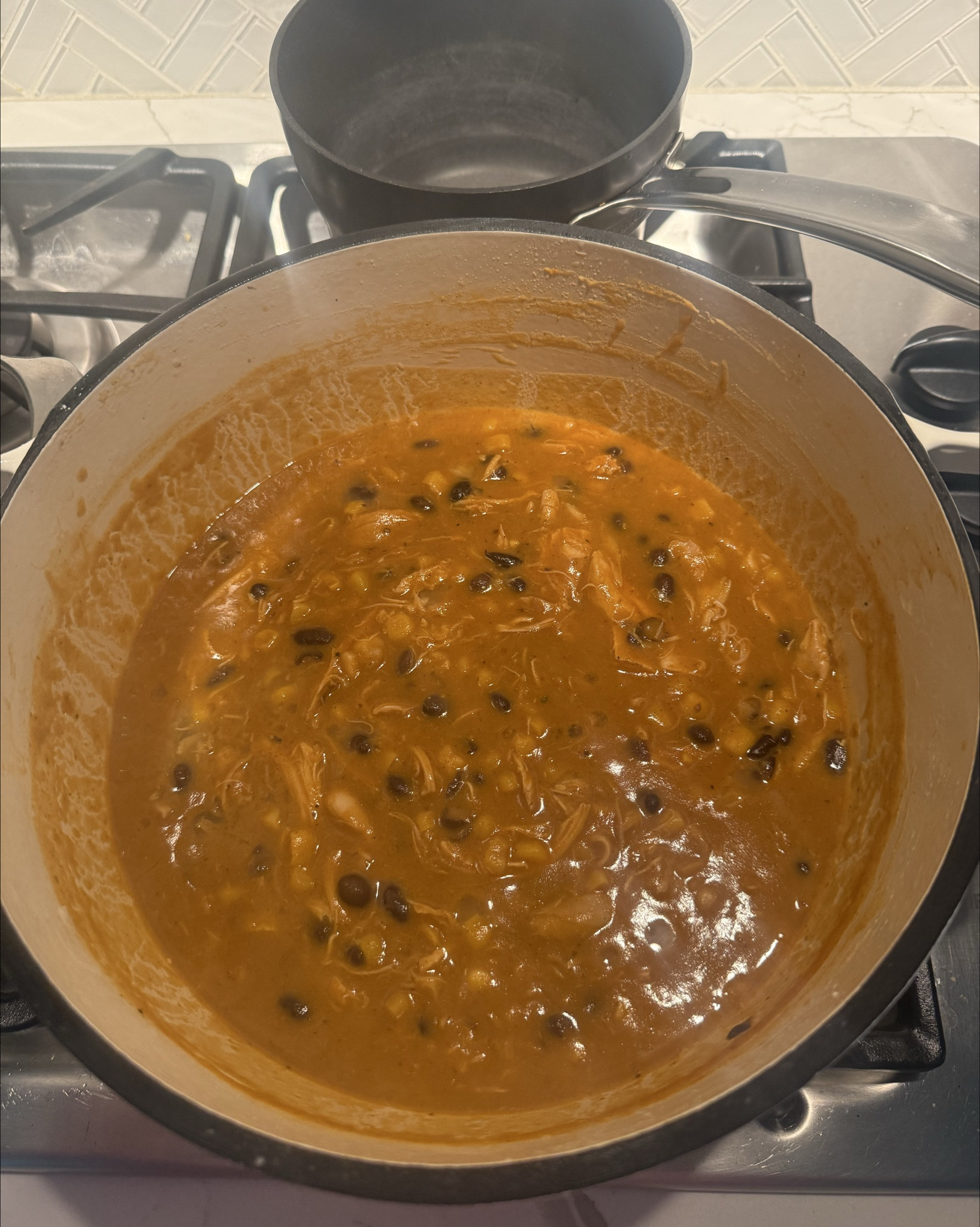 Minced 2 cloves garlic
1/2 chopped yellow onion
Sautéed those in butter
Poured in chicken bone broth
Added rotel with chillis
Let cook to a boil -
Poured into vitamix
added 1/2 package of cottage cheese
Blended on soup setting
Poured back in pot
Added corn
Black beans
pulled rotisserie chicken
Salt/pepper-Let simmer
Serve with tortilla chips or jalapeños, whatever toppings

#LTKFindsUnder50 #LTKHome #LTKFamily