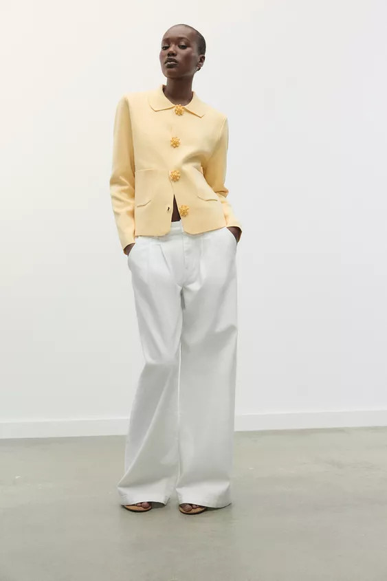 Lapel collar jacket with long sleeves. Front patch pockets. Front beaded button closure. | Zara US