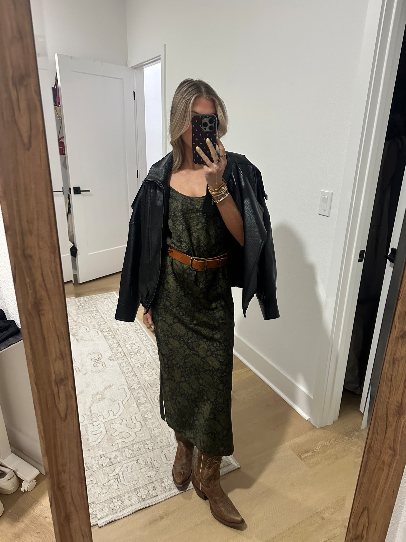 Friday night outfit! I wore a @fashionpass @caminyc satin green midi dress and my belt is from @oldstudhandmade I am obsessed with it. My boots are from boot barn Idyllwind of course and I ended up wearing a faux leather jacket over my shoulders too  

#LTKootd #LTKSeasonal #LTKgrwm
