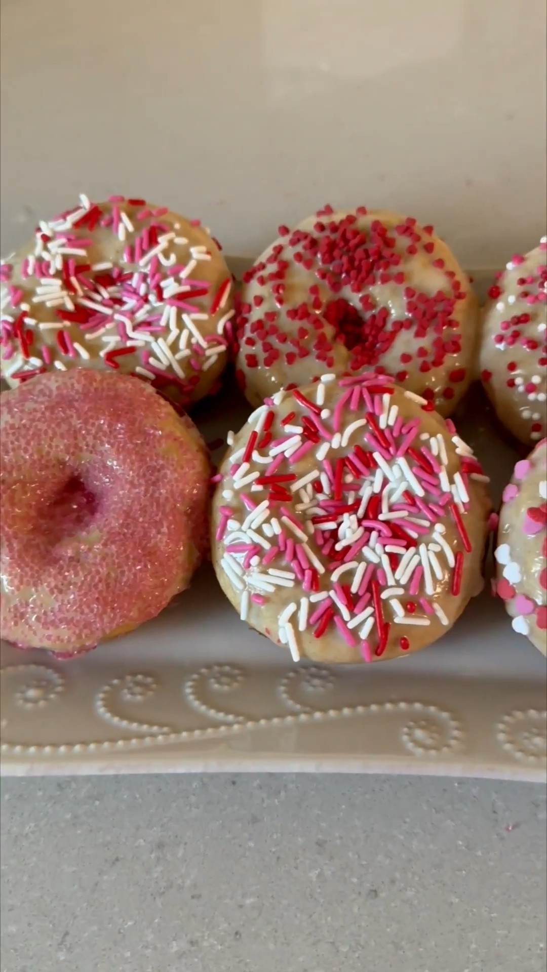 Make Valentine’s Day Donuts with me ❤️💗 This recipe has become favorite in our house! The kids love them 👌 

Donuts
• 1/2 cup of plain Greek yogurt 
• 1/2 cup of milk 
• 1/4 cup of unsalted butter (melted and cooled)
• 1 egg (lightly beaten)
• 1 teaspoon of vanilla extract 
• 1 1/2 cups of all purpose flour 
• 1/3 cup of sugar 
• 1 teaspoon of cinnamon 
• 1 teaspoon of baking powder 
• 1/2 teaspoon of baking soda 
• 1/4 teaspoon of salt 
Glaze 
• 1 cup of powdered sugar 
• 4-5 tsp of milk
• 1/2 tsp of vanilla extract 

(Topping option) 
Cinnamon Sugar Topping 
• 1/4 cup of sugar
• 1/2 teaspoon of cinnamon 
• 2 tablespoons of melted butter 

Preheat the oven to 375 degrees F and grease two 6-cup donut pans with nonstick spray.
Add the yogurt, milk, butter, egg, and vanilla to a medium bowl. Whisk to combine well.
Add the flour, sugar, cinnamon, baking powder, baking soda, and salt to the bowl. Whisk to combine into a thick batter.
Use ¼ cup batter in each prepared donut spot.
Bake for 12-14 minutes, or until puffed up, golden brown, and a cake tester or toothpick inserted into the center of a donut comes out clean.
Remove from oven and let cool for a minute or two. Run a knife around the edges to loosen, as needed, then transfer donuts to a wire rack to cool completely.
In a small bowl mix powdered sugar, milk and vanilla and whisk them together. Dip the tops of the donuts to cover with glaze and then add your sprinkles! 
Optional: Stir the sugar and cinnamon together in a small bowl. Dip the top of each donut first in the melted butter, then in the cinnamon-sugar mixture. This makes them taste just like a cake donut! 
(Recipe from Yummy Toddler Food) 

Homemade donuts, Amazon, kids breakfast, donut molds, breakfast ideas, kids meals, Valentine’s Day treat, Valentine’s Day breakfast, kids Valentine’s Day

#LTKfoodie #LTKmomlife #LTKValentine