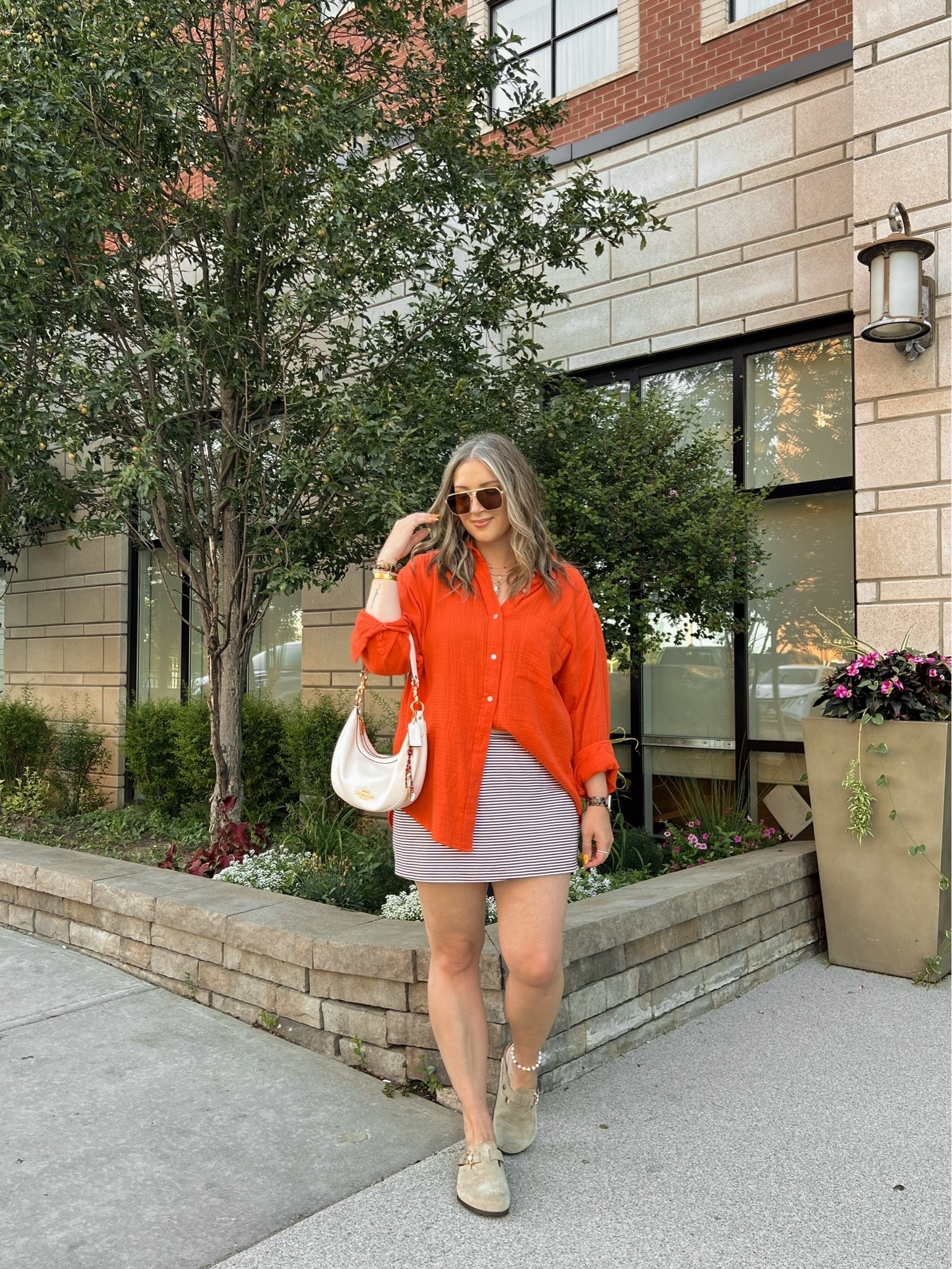 Easy summer outfit! Wearing my usual size L in both the red orange shirt and striped mini skirt (has built in shorts!). Birkenstock Bostons are super comfy, I’m a 9.5-10 shoe and wear size 40

#LTKsummer #LTKsale #LTKmidsize