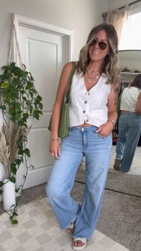 Forever in my wide leg jeans era 🤟🏻
Spring outfit inspo

Jeans - 8 long, sized down per reviews, available in xtra long and 4 colors! Up to 30% off with code: EXTRASUMMER
Vest is old, linked similar 
Sandals - 11, 4 colors
Bag comes in a lot of colors too and has a clutch/pouch that’s removable inside


#LTKmidsize #LTKVideo #LTKstyletip