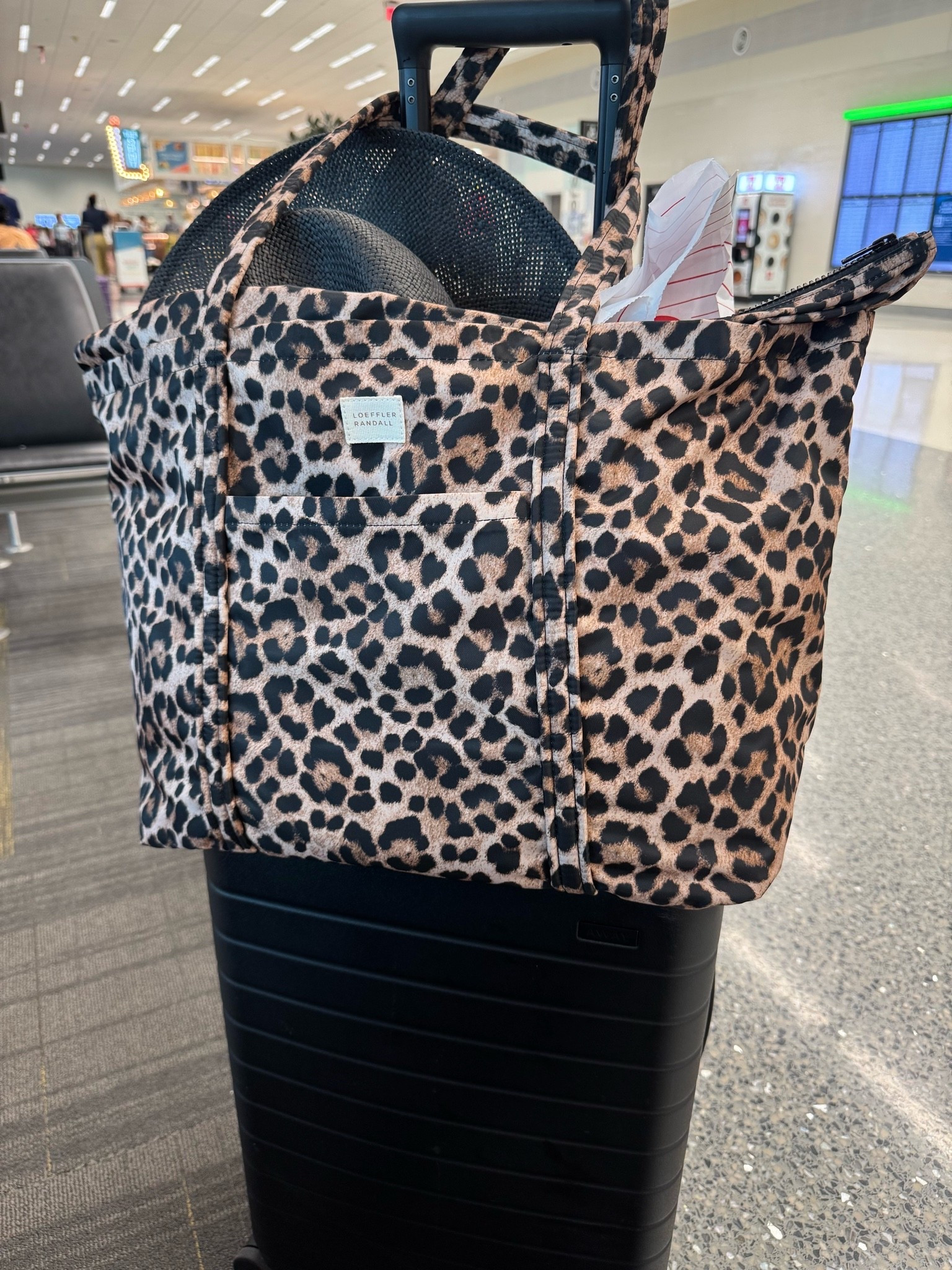 Liz’s favorite leopard carry-on tote - holds a ton, has a zipper, and is under $200.

#LTKTravel