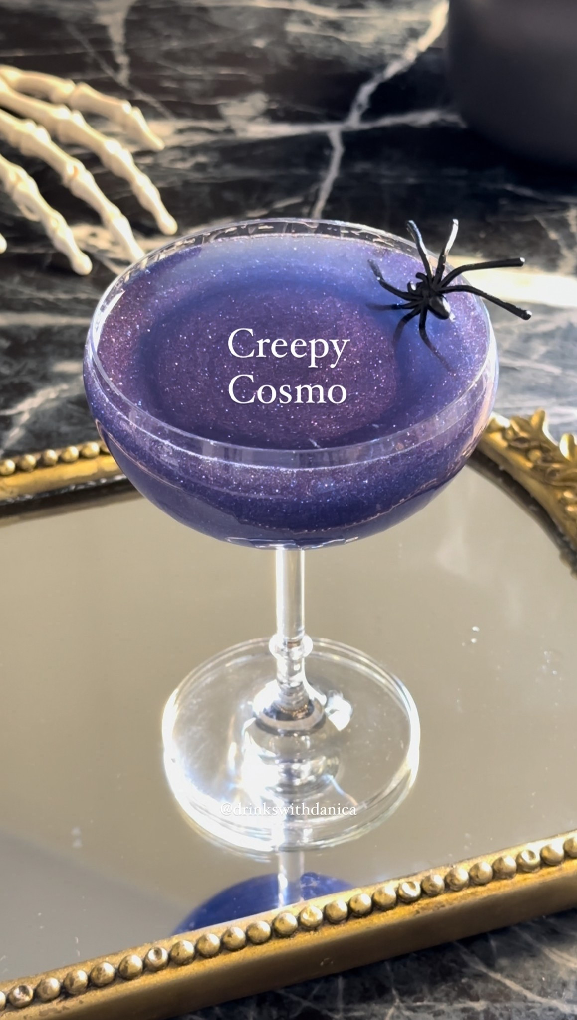 Creepy Cosmo

Follow me on instagram and TikTok @drinkswithdanica for this recipe and more 