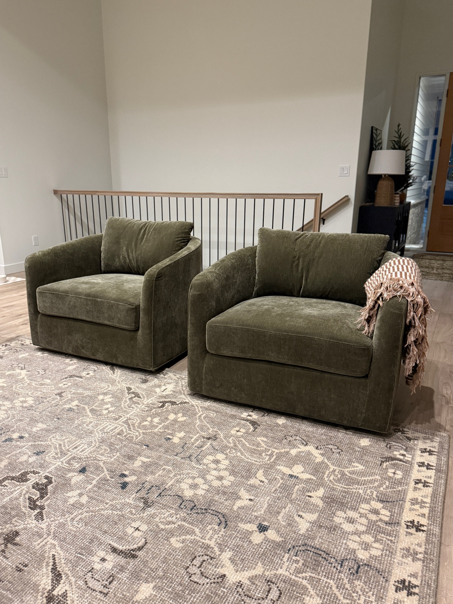 Loving our new green chairs! The bottom cushion is more on the firm side but the back cushion is super soft and cloud like. The color is to die for!! 😍 They are super wide and feel like a chair and a half. Linked a similar rug and more affordable chair option  

#LTKHome #LTKStyleTip