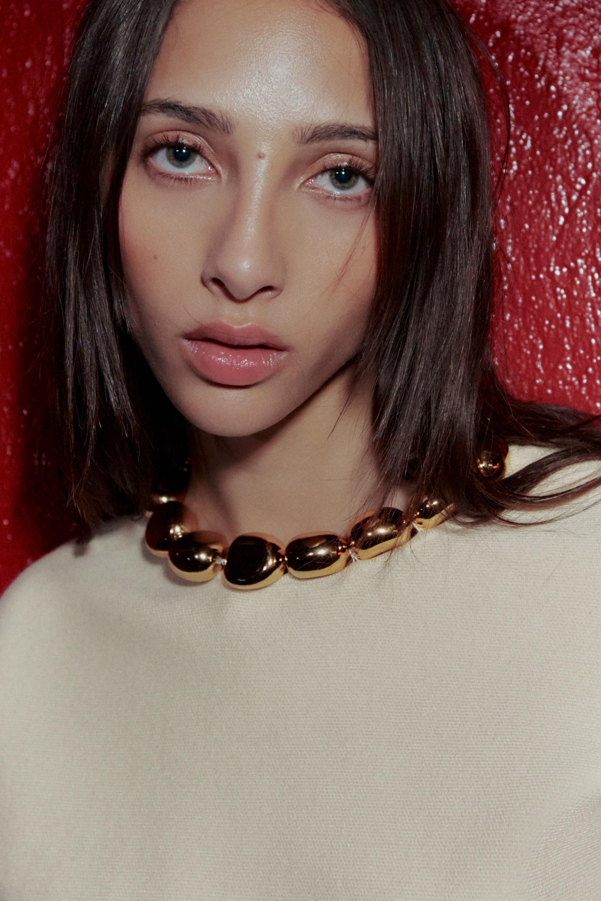 JUMPER WITH BALLS ON THE NECK | Zara UK