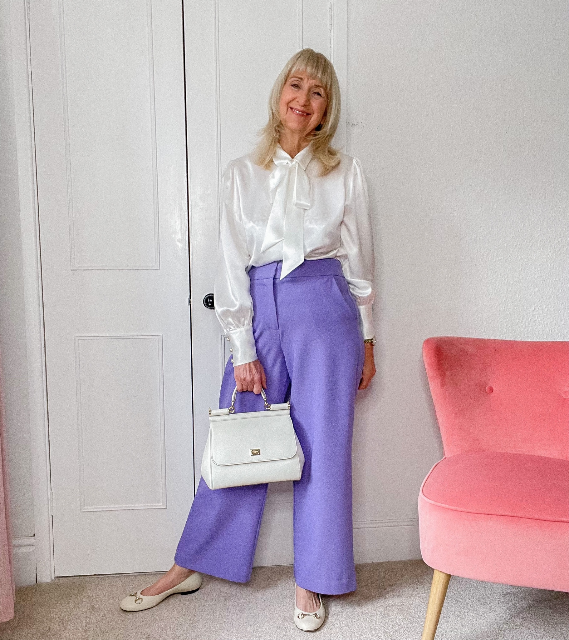 Spring Outfit 
Purple wide legged trouser, white silk blouse with a pussy bow , white Gucci ballet shoes and white D&G Sicily bag . 

#LTKSeasonal #LTKstyletip #LTKitbag