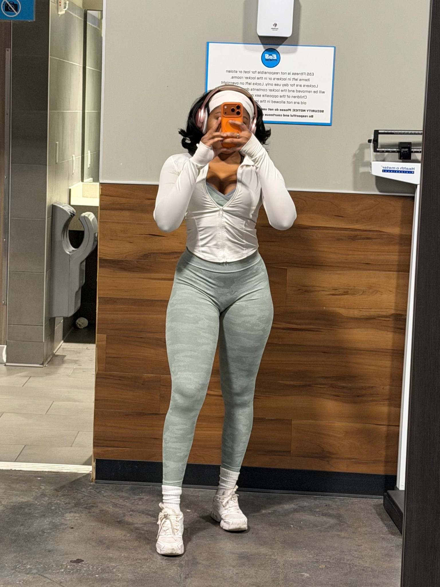 Fitted cropped white workout jacket with matching camo set bra + leggings 