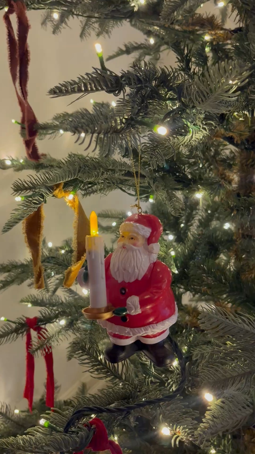 Magic Santa ornament! You blow out the candle and the tree turns off!