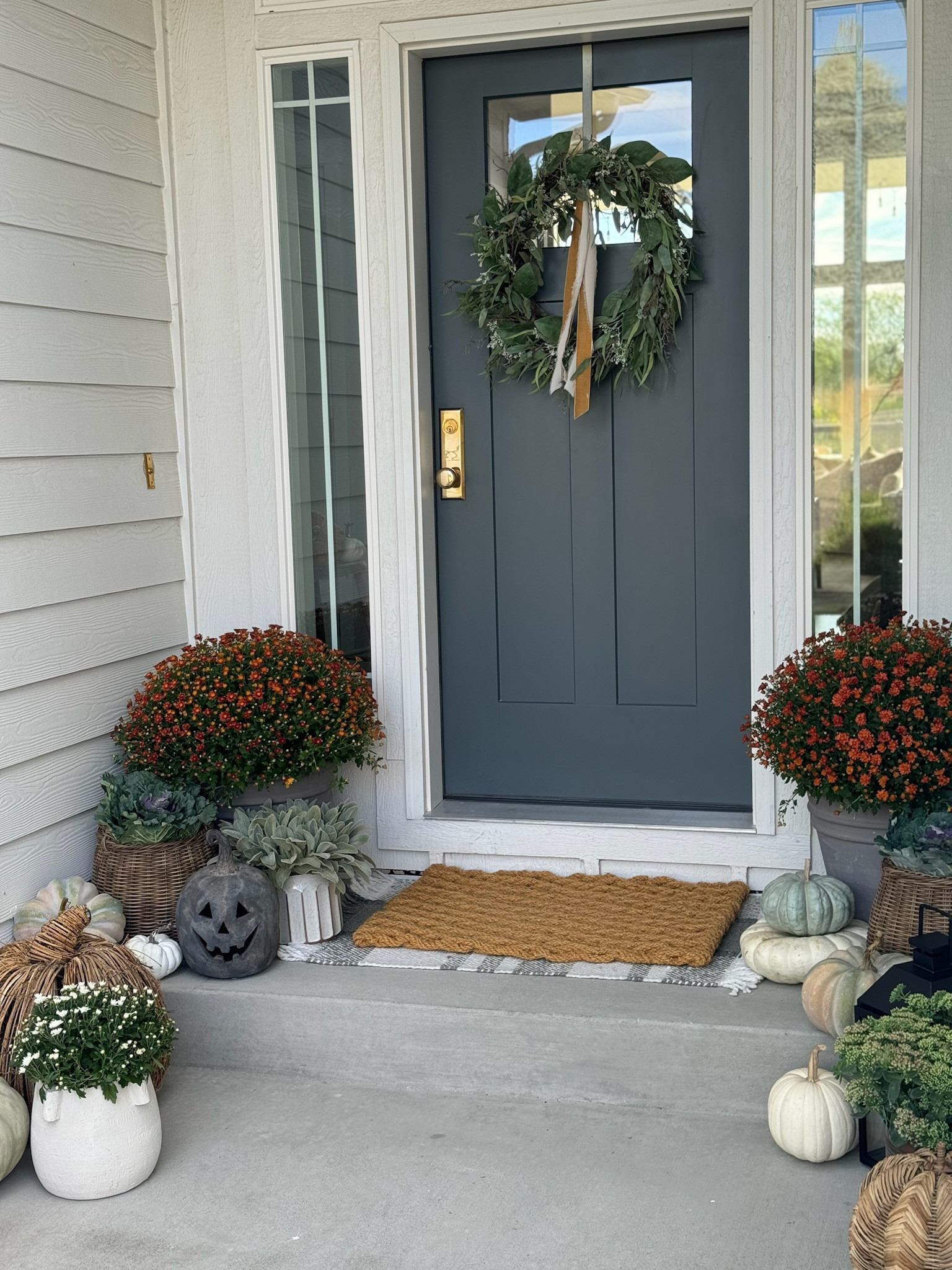 My fall front porch! I used a combination of finds I already had with new ones such as these pumpkins, lanterns, and a few others for a timeless and true fall look! I’ll add in my Halloween decor as well near October! 

#LTKStyleTip #LTKSeasonal