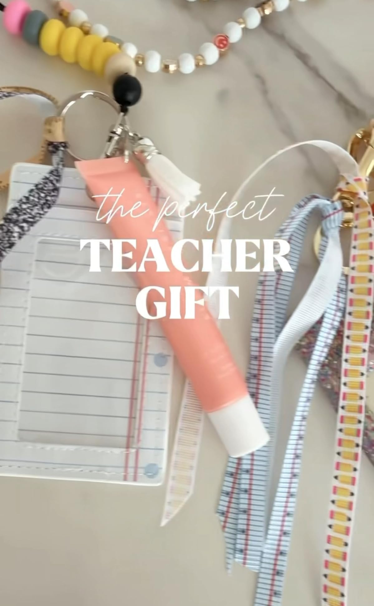 Cutest back-to-school teacher gift idea! 🍎✨
Summer Fridays lip balm, a fun beaded lanyard, themed ribbon, cute badge ID, and a keychain—because teachers deserve a little treat to kick off the year in style!

#TeacherGiftIdeas #BackToSchoolGifts #LTKBackToSchool #TeacherStyle #AmazonFinds 

 #LTKU #LTKFindsUnder50 #LTKKids