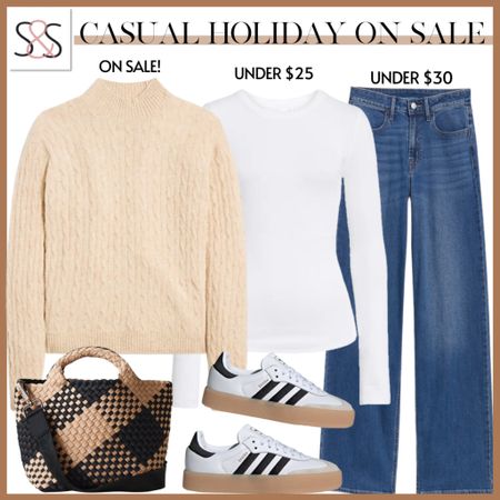 A sweater over a white tee with jeans is a great way to wear your winter holiday favorite ottjt !